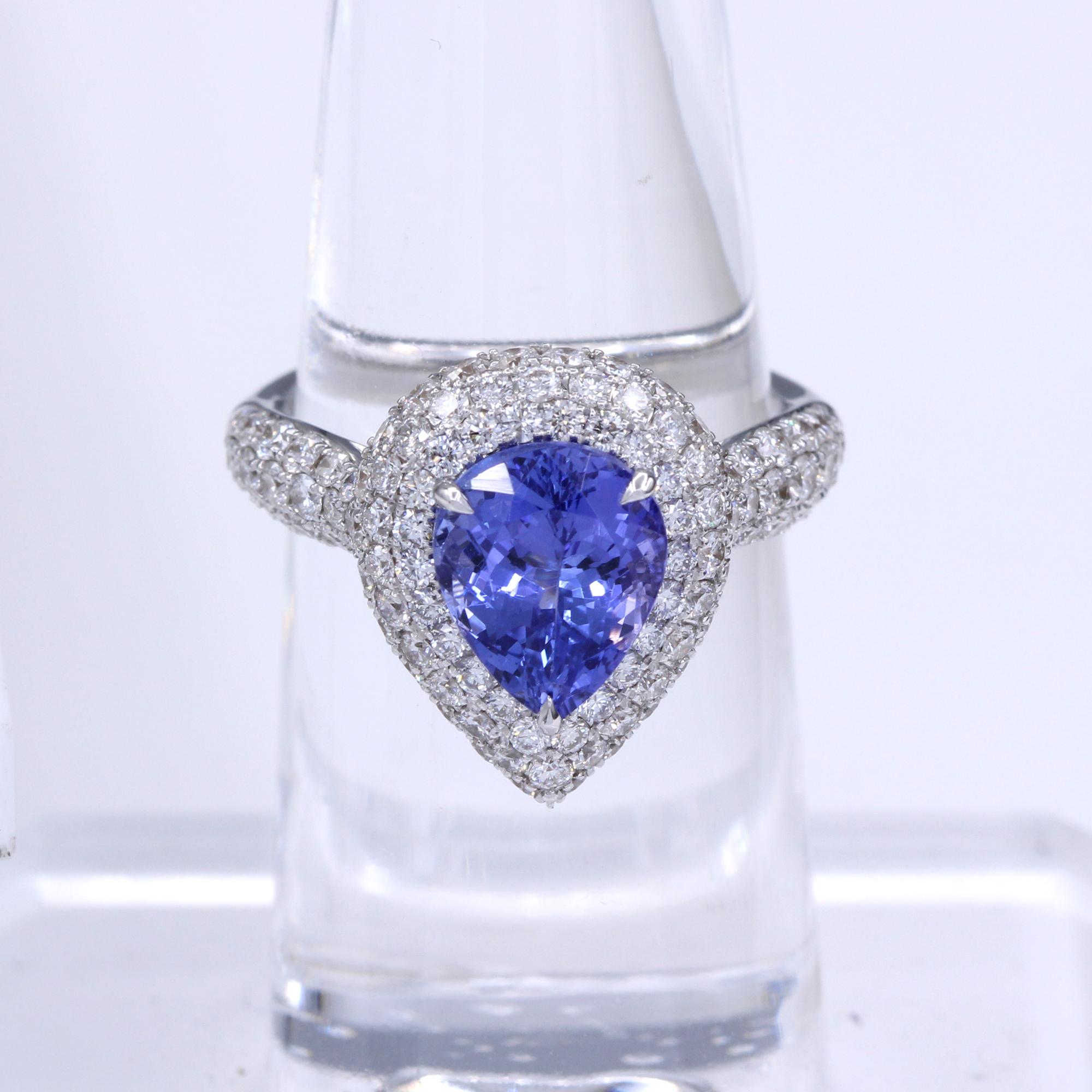 Fancy Tanzanite Ring & Diamonds, Pear Shape Tanzanite AAA brilliant deep purple 3.28 carat 10 x 8 mm.
Total all Diamonds 1.78 carat G-SI, 18k White Gold 7.0 Grams, Finger Size 7.
