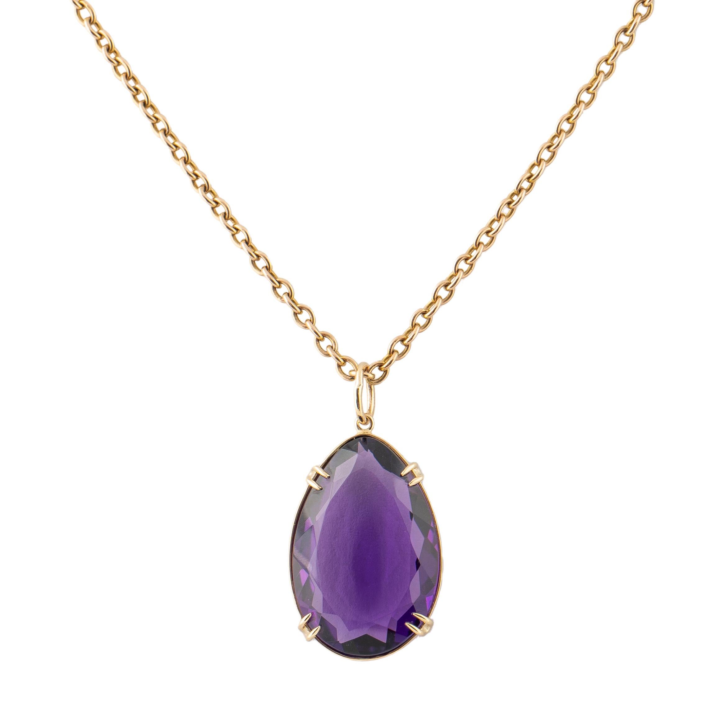 Beautiful custom made amethyst 18k yellow gold pendant set with a tear drop shaped faceted amethyst of deep violet color, bezel and prong set in 18k yellow gold with circular suspension ring to accommodate most chains. 

Amethyst measures 28 x 6.8 x