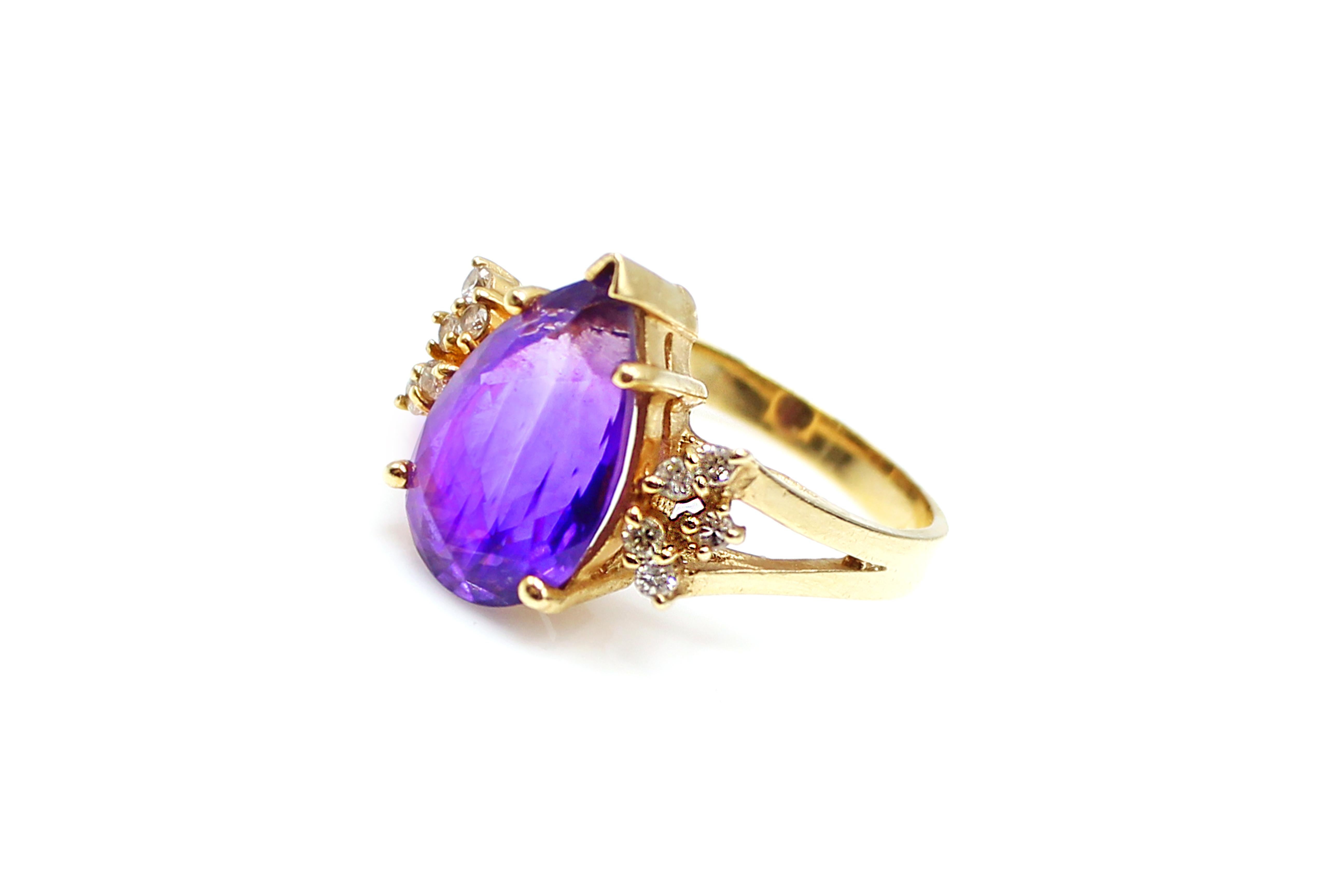Beautiful and extremely well handcrafted ring from the 1960s, showcases an amazingly intense violet pear-shape Amethyst, measured to weigh approximately 3.50 carats. The Amethyst is held by 4 polished prongs and at the top. The split shank is