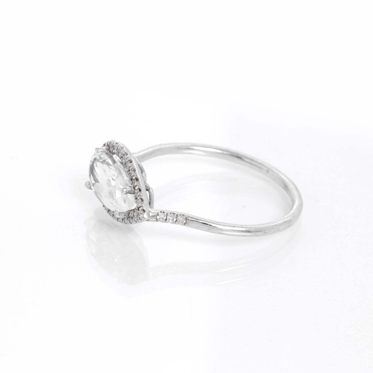 Pear Shaped Beryl & Diamond Ring Size 6.75  - 114K white gold ring with a center Beryl stone pear shaped measuring .20 cts . surrounded by  .2 cts of diamonds.  Total weight 1.6 grams .