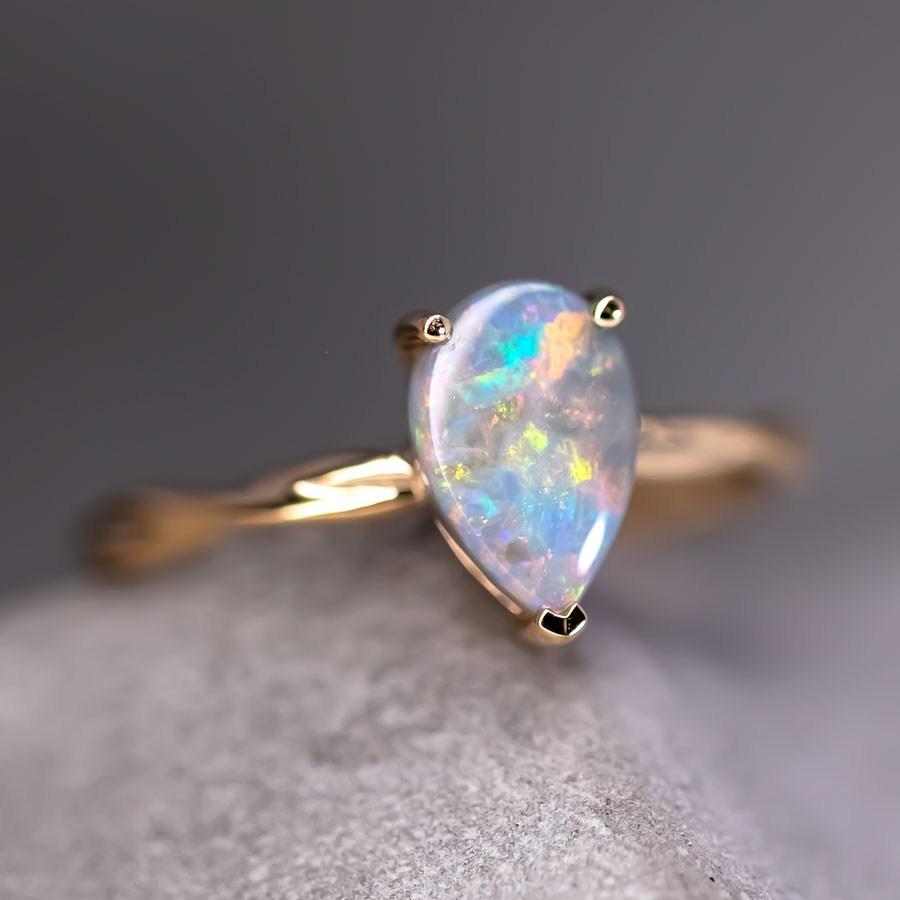 Pear Shaped Australian Black Opal Twist Band Engagement Ring 18K Yellow Gold.


Free Domestic USPS First Class Shipping! Free Gift Bag or Box with every order!

Opal—the queen of gemstones, is one of the most beautiful gemstones in the world. Every
