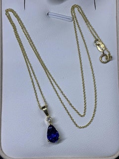 Pear-shaped blue sapphire and diamond pendant necklace 18k yellow gold