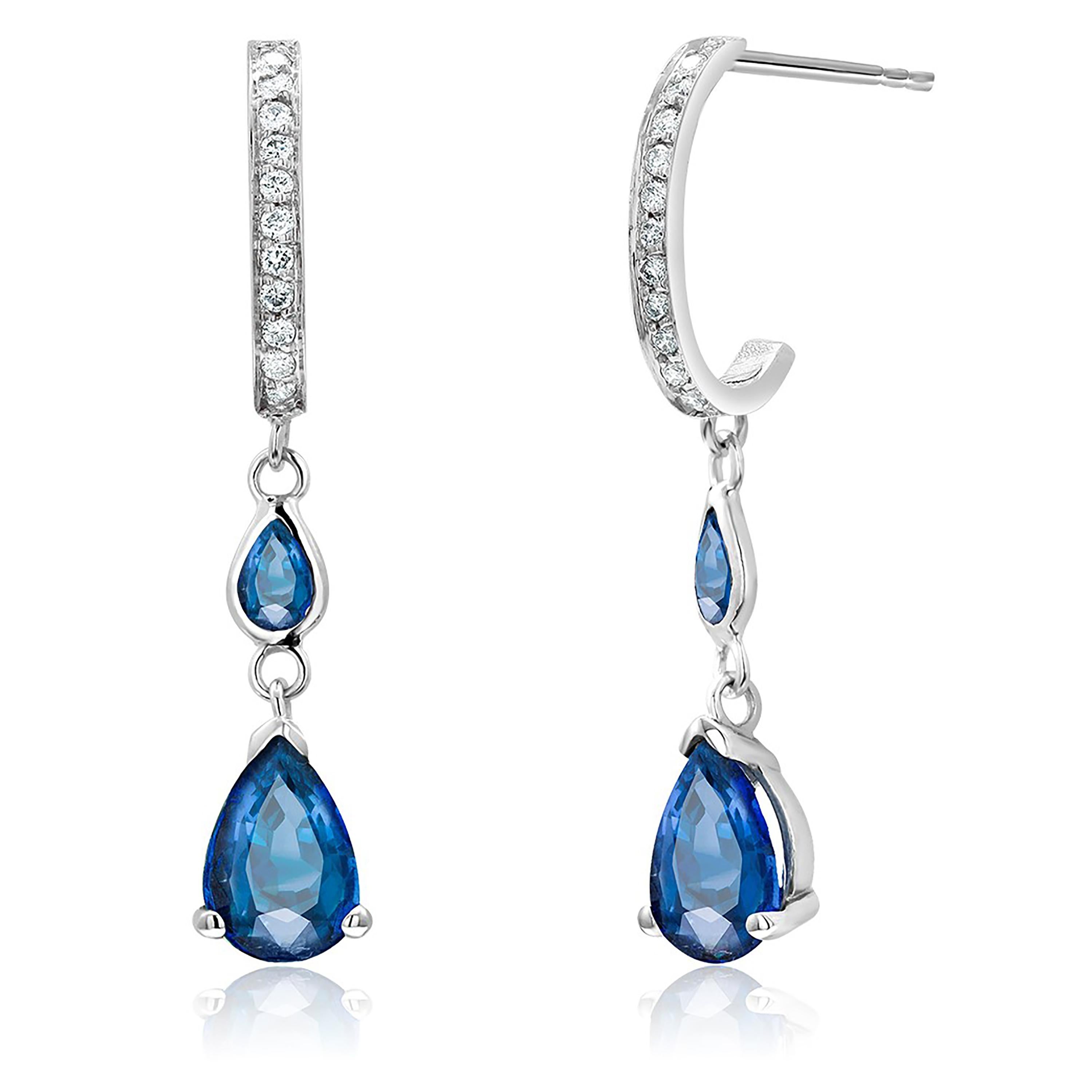 Fourteen karats white gold drop hoop earrings 
Diamonds weighing 0.25 carat 
Four pear shapes royal blue sapphires weighing 2.39 carats
Sapphire hue tone color is royal blue
Earrings 1.25