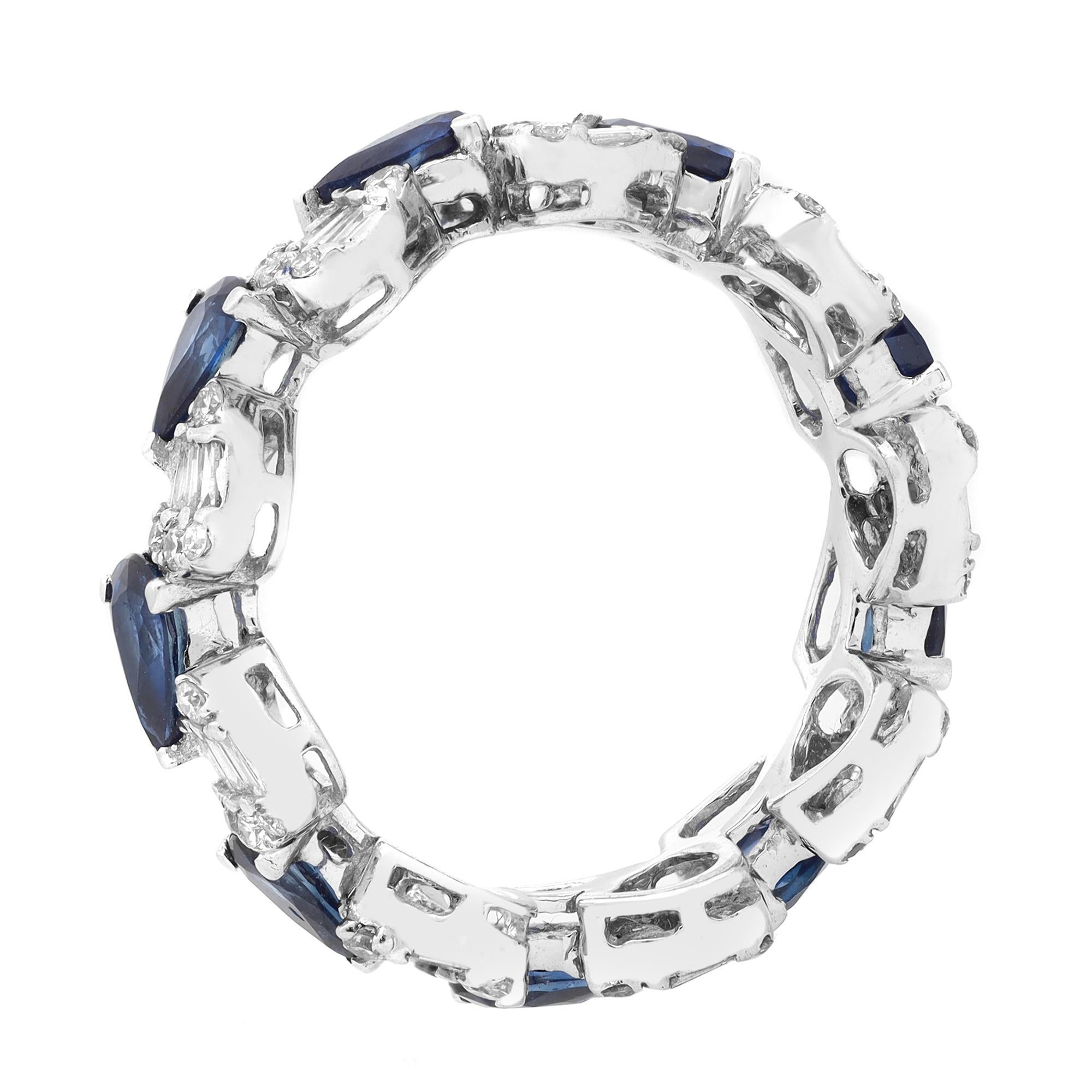 This beautiful eternity band ring features 9 prong set Pear shape scintillating Blue Sapphires alternating with channel set Baguette and Round cut diamonds in pear shaped shank, giving it a spectacular contrast. The stones are beautifully circling
