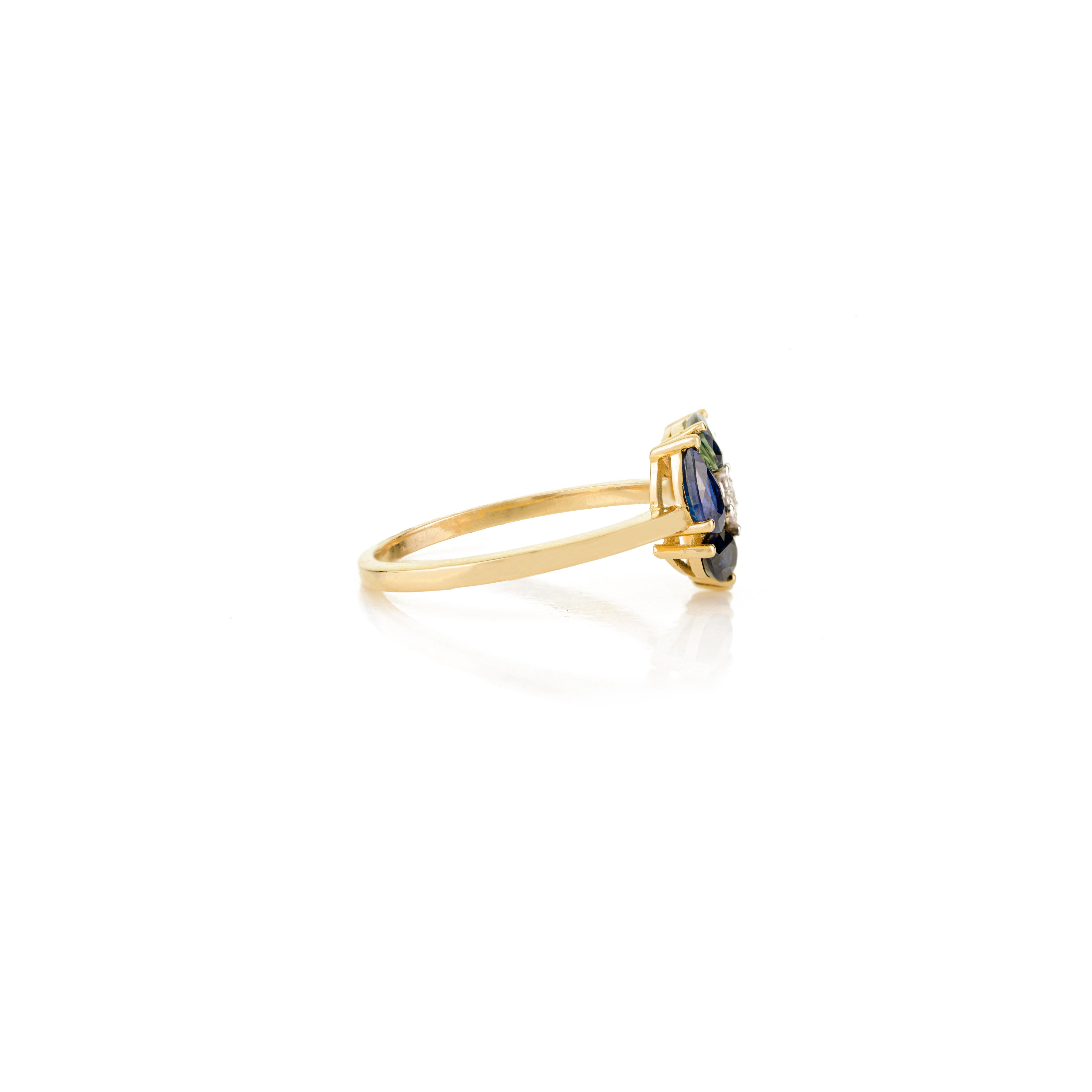 in vendita:  Anello a grappolo di zaffiri blu a forma di pera in oro giallo 14k con diamanti 7