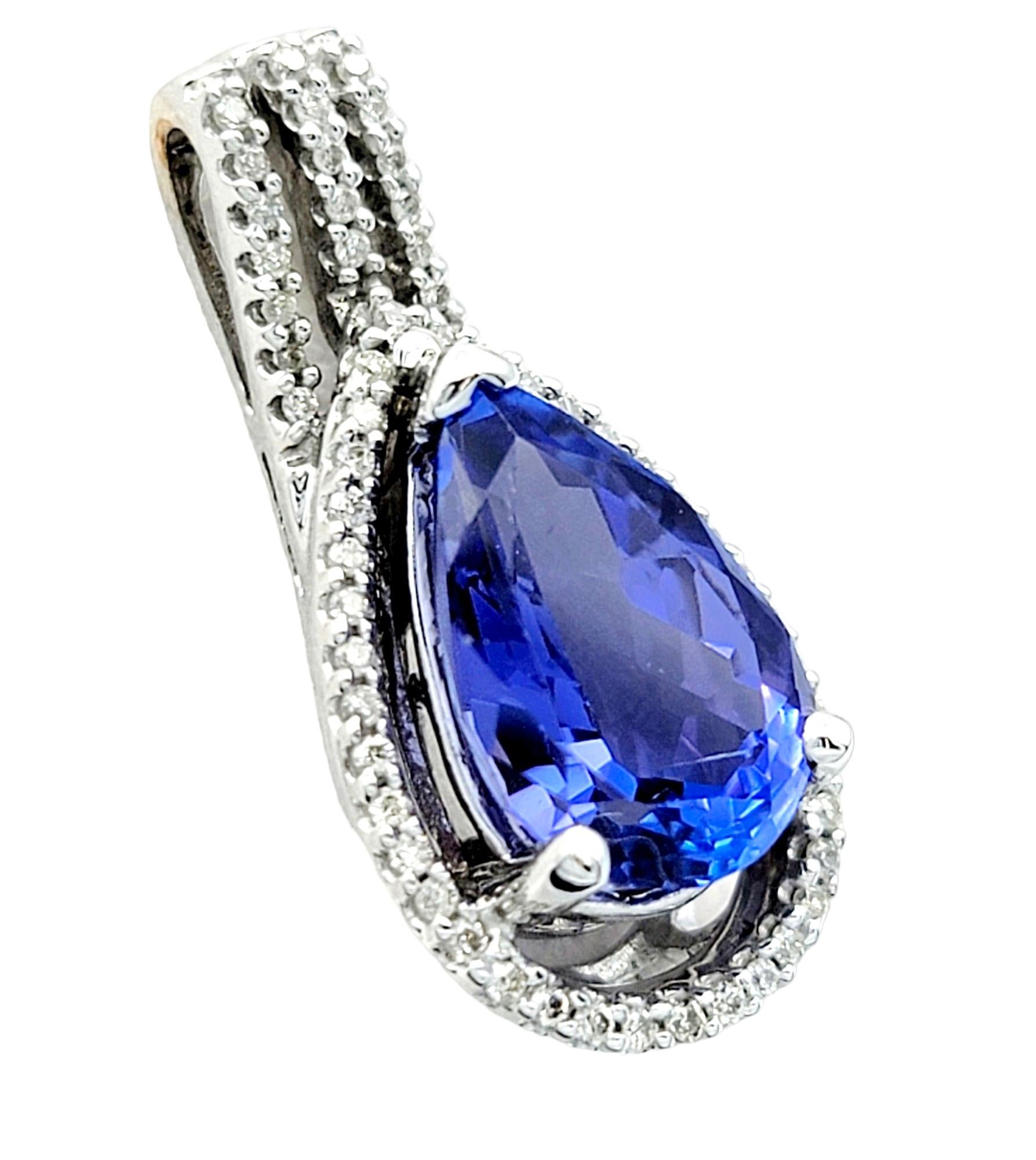 This enchanting pendant set in luxurious white gold, features a stunning pear-cut tanzanite in a mesmerizing violet hue. The tanzanite's color-shifting quality, reflecting both blue and purple hues in different lights, adds a dynamic and magical
