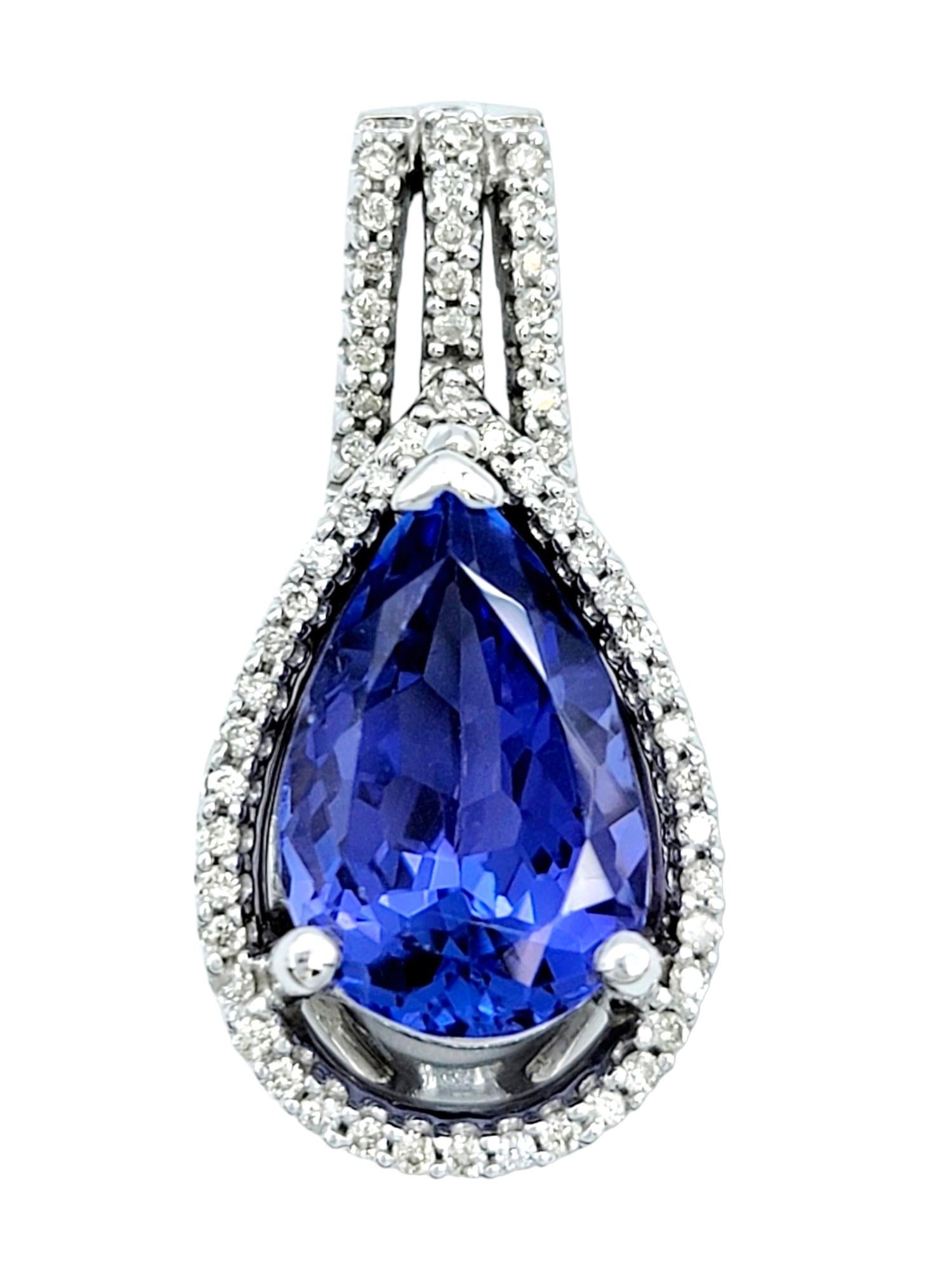 Pear Cut Pear Shaped Blue Tanzanite Pendant with Diamond Halo Set in 14 Karat White Gold For Sale