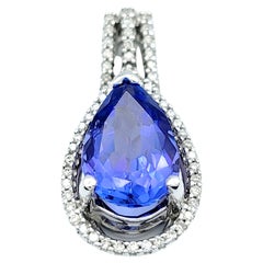 Pendentif en or blanc 14 carats avec tanzanite bleue en forme de poire et halo de diamants