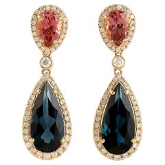 Boucles d'oreilles pendantes en forme de poire avec topaze bleue et tourmaline rose avec diamants