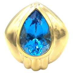 Pear Shaped Bright Blue Bezel Set Topaz Cocktail Ring in 14K Gold