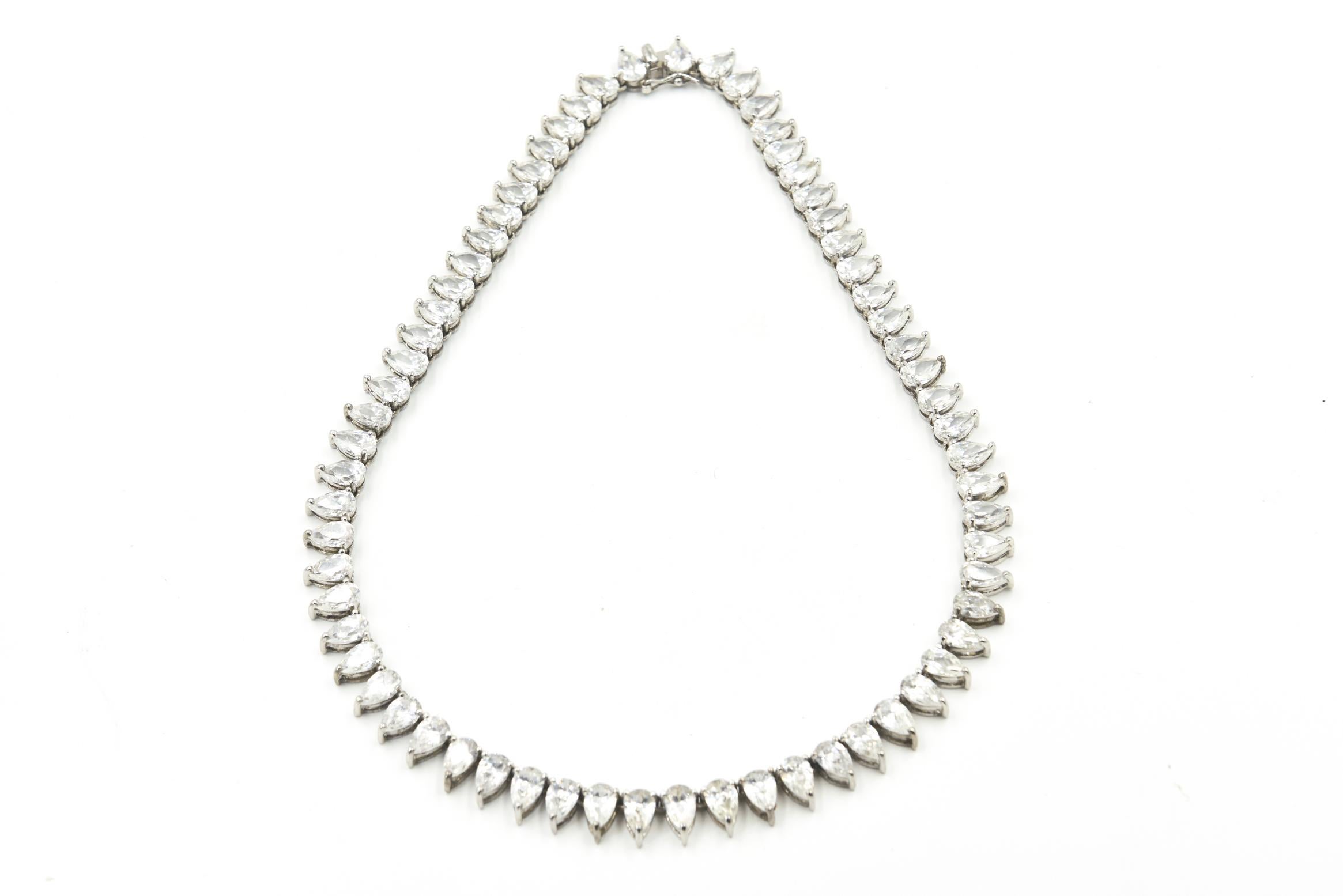 Perfect necklace for a big event it belonged to a socialite who wore at galas where people assumed it was real.  This design is referred to as a line, tennis or riviera style.  It  features 66 pear shaped CZs that look like .70 carat each diamonds. 