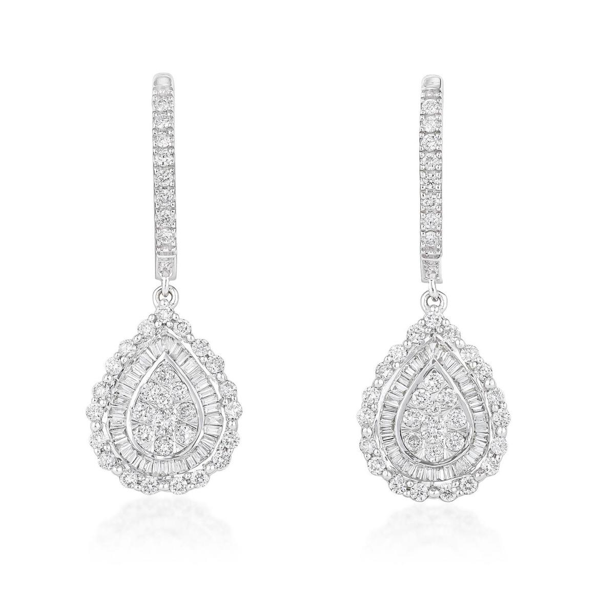 Very Pretty Pear shaped diamond cluster dangle earrings beautifully handcrafted in 14K white gold. 
The details are as follows :
Diamond weight : 1 carat ( G color and VS clarity ) 
Measurements : 32mm length of the earrings 
Pear shape drop