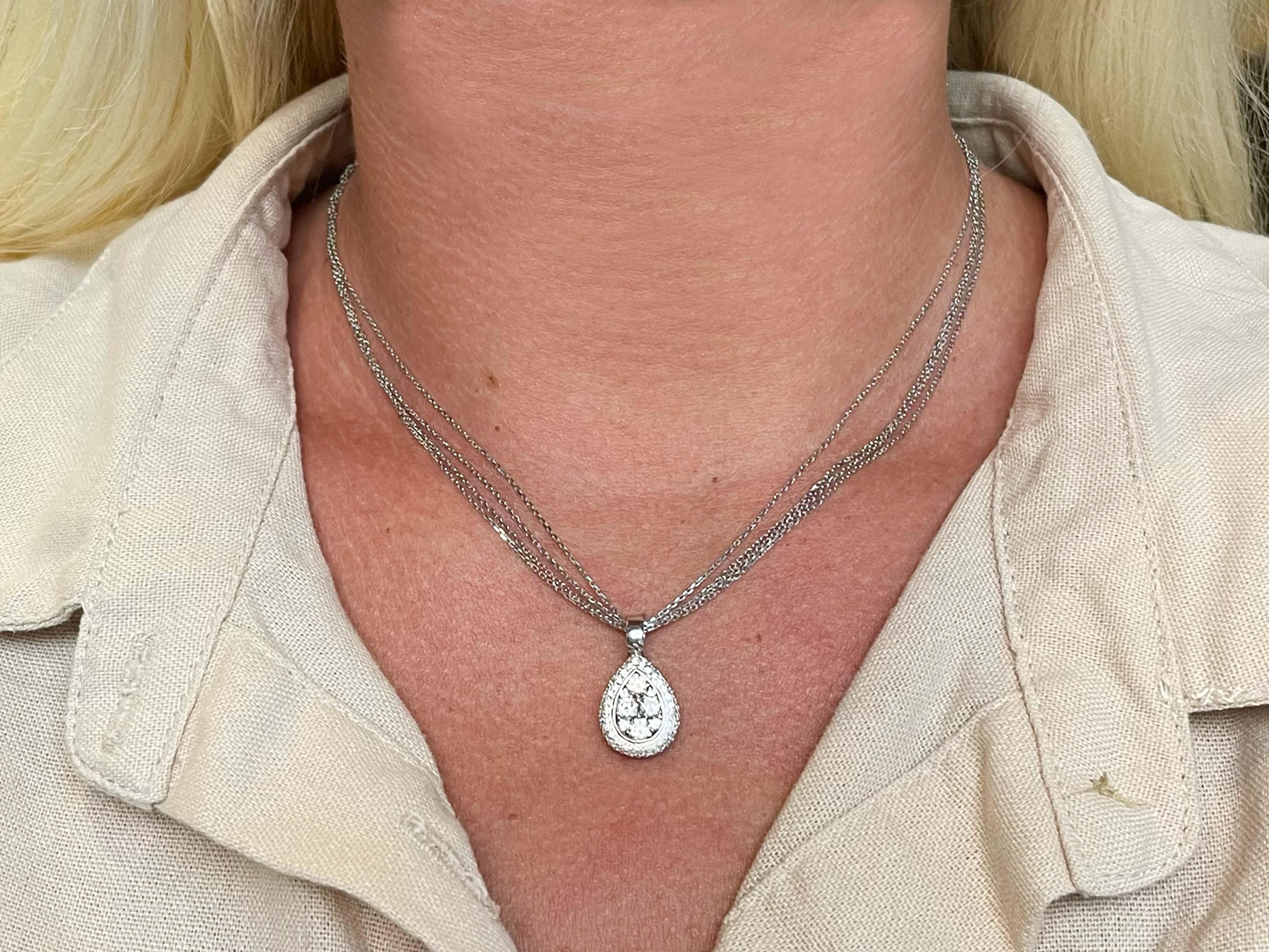 Item Specifications:

Necklace Metal: 14k (chain) and 18k (pendant) White Gold

Total Weight: 10 Grams

Chain Length: 18