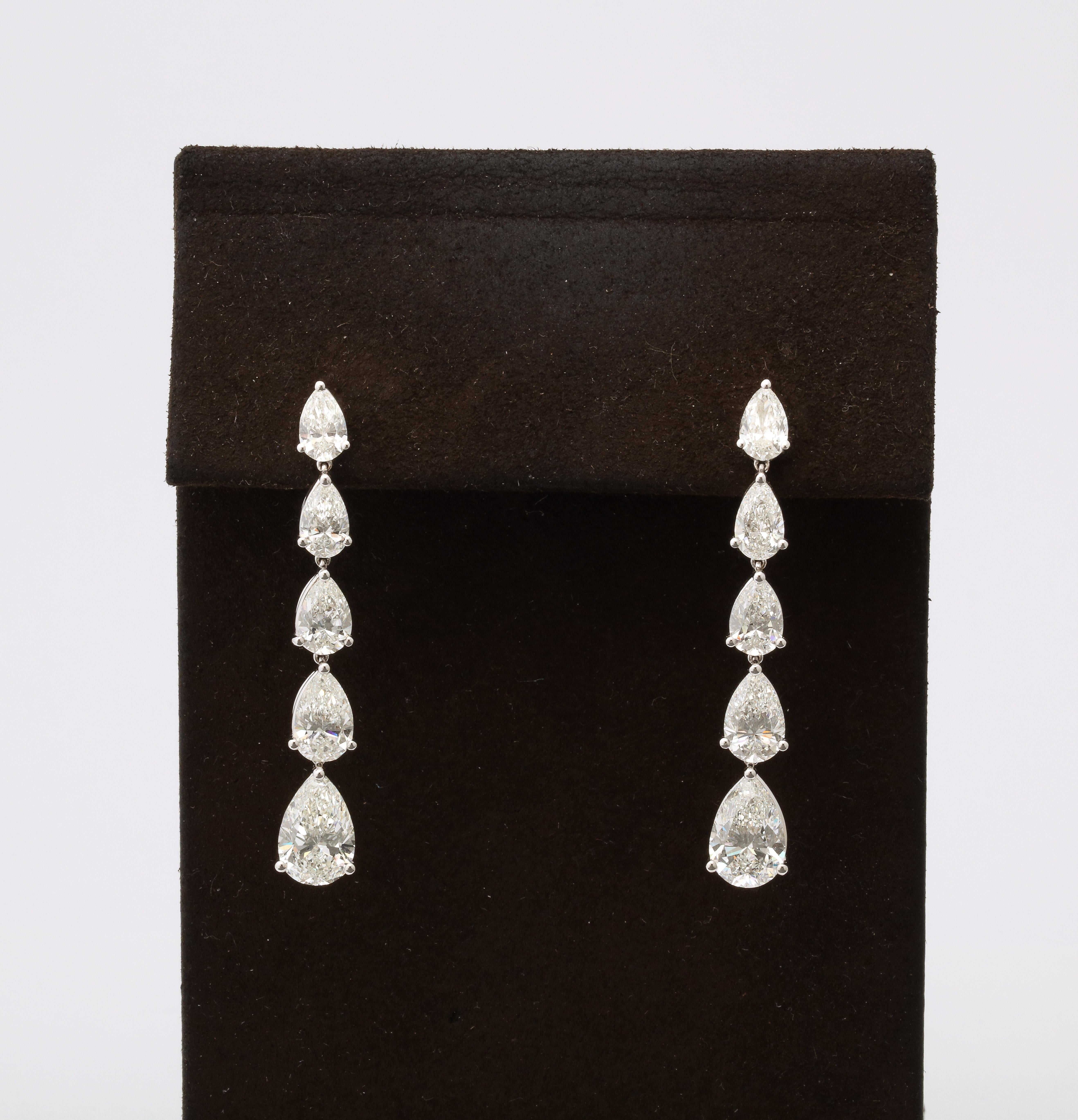 
A fabulous earring in a timeless design! 

9.51 total carats of white pear shaped diamonds with 2 carat each drops.  

18k white gold 

Approximately 1.80 inches in length. 

The perfect earring to add to anyones collection. 