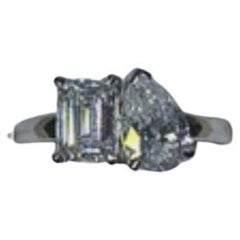 Pear shaped diamond GIA E SI1 0.91ct, emerald 0.95ct cut diamond GIA H VS1.