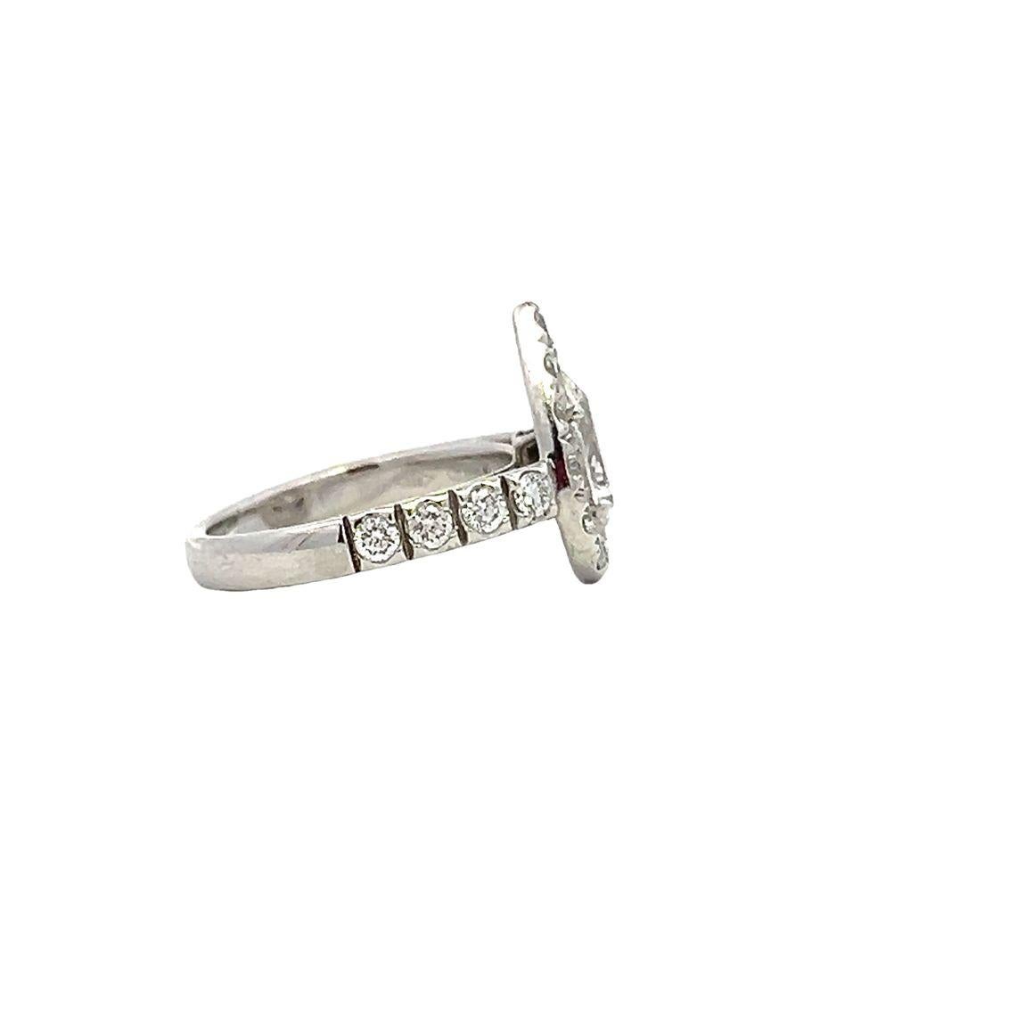 Contemporary Pear Shaped Diamond Halo Ring in Platinum For Sale