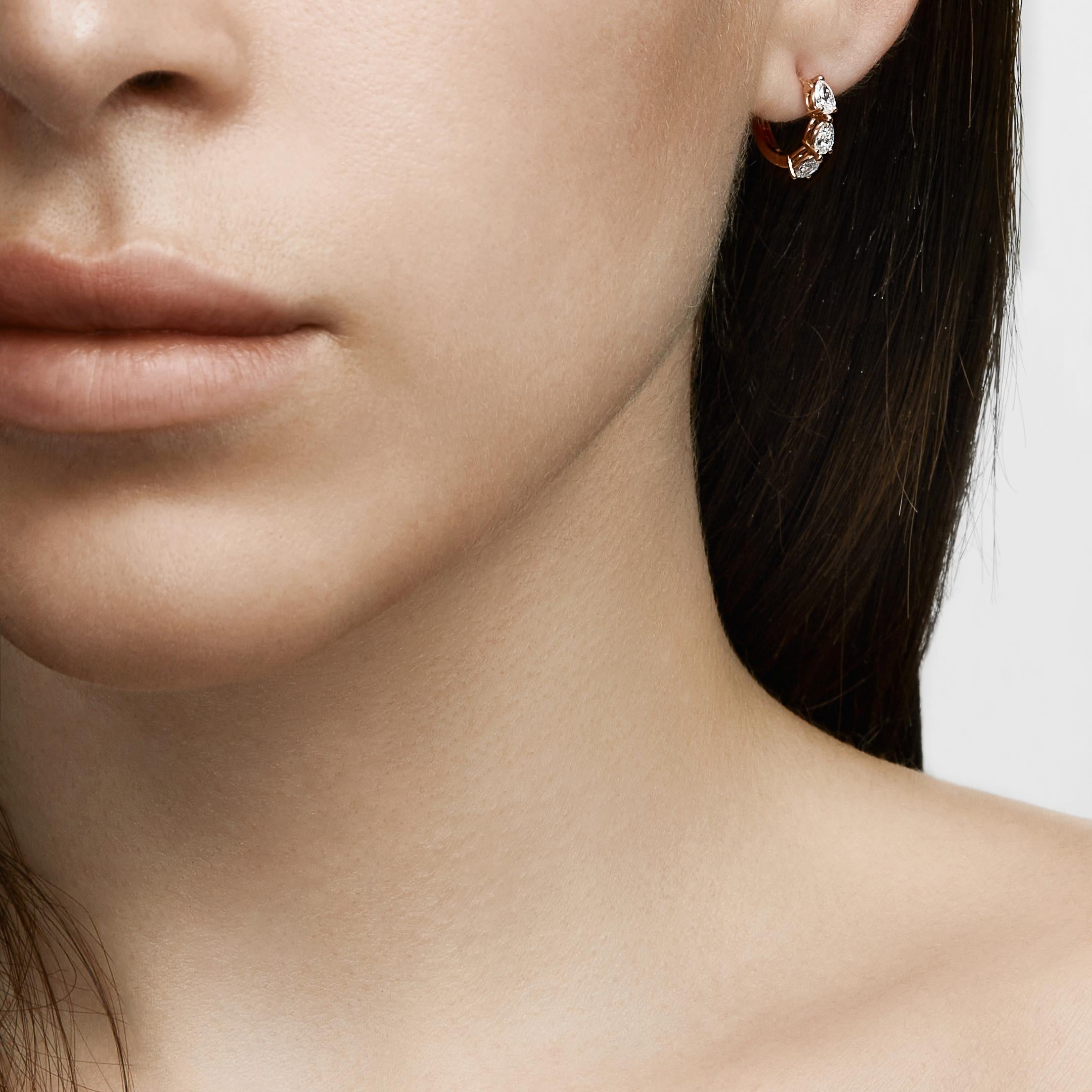 Everyone needs a perfect diamond hoop earring to take them from the office to dinner plans to weekend brunch with friends. The Pear-Shaped Diamond Huggies are just that versatile fine jewelry staple. Crafted in 18-karat gold, these huggie hoop