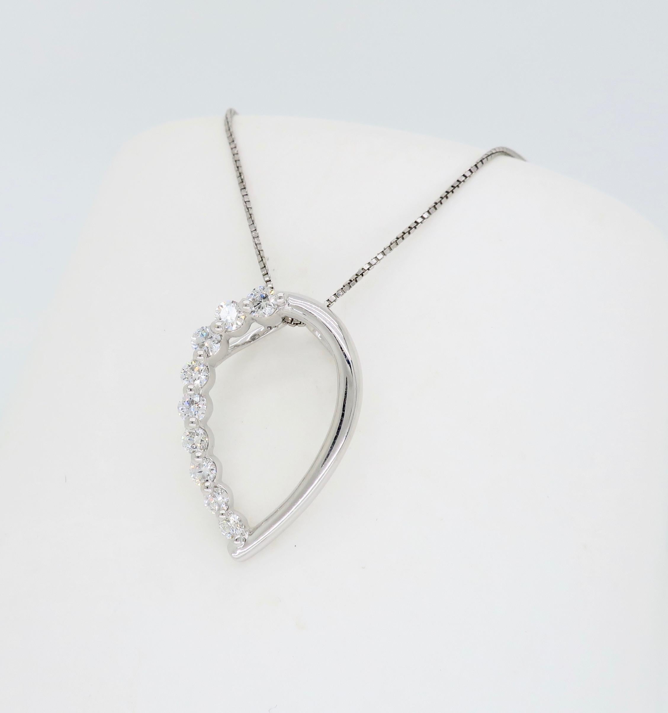 This elegant  white gold necklace features 9 Round Brilliant Cut Diamonds elegantly cascading down one side of the pear shaped pendant.

Diamond Carat Weight: .33CTW
Diamond Cut: 9 Round Brilliant Cut
Color: Average G-I
Clarity: Average SI
Metal: