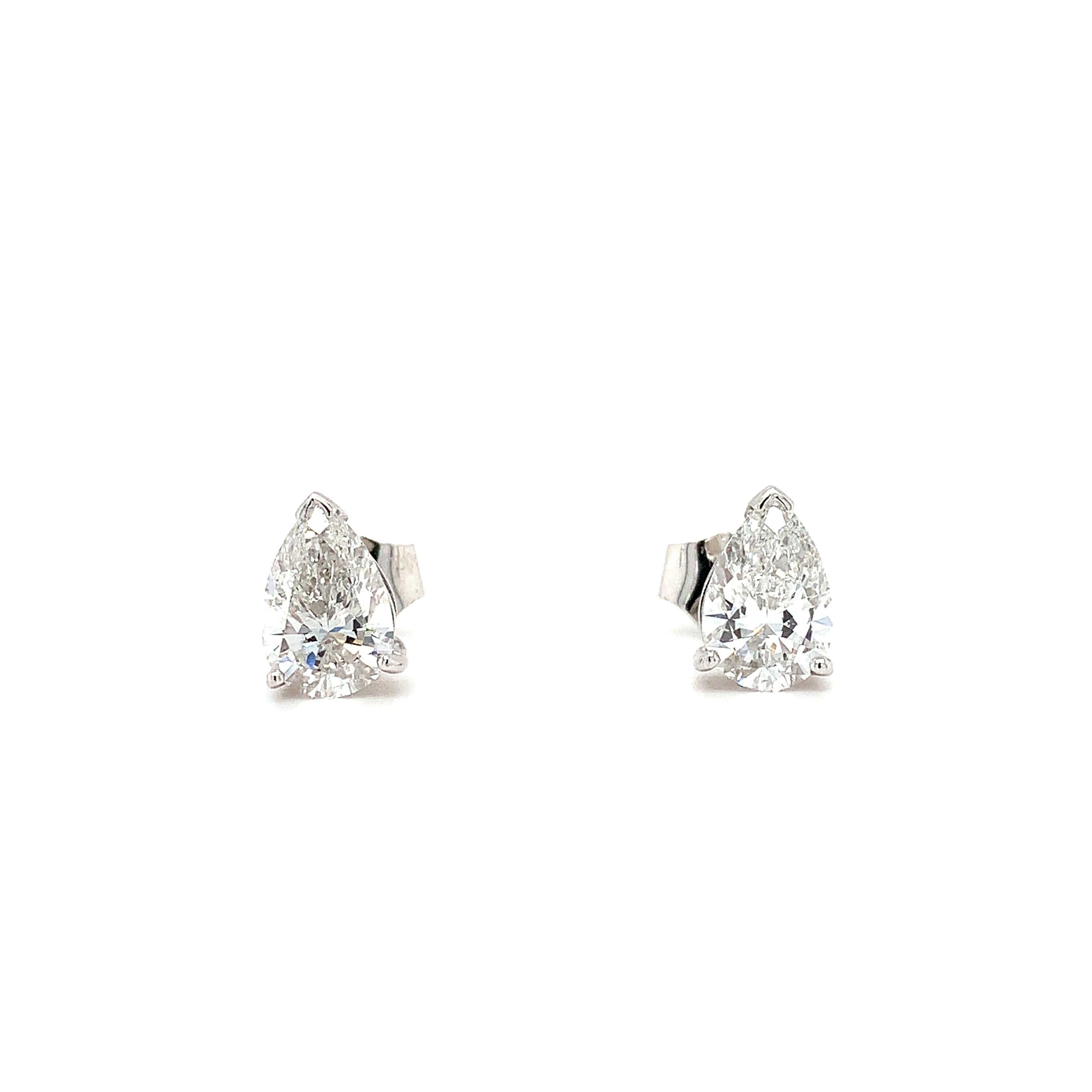 Modern Pear shaped diamond stud earrings 18k white gold For Sale