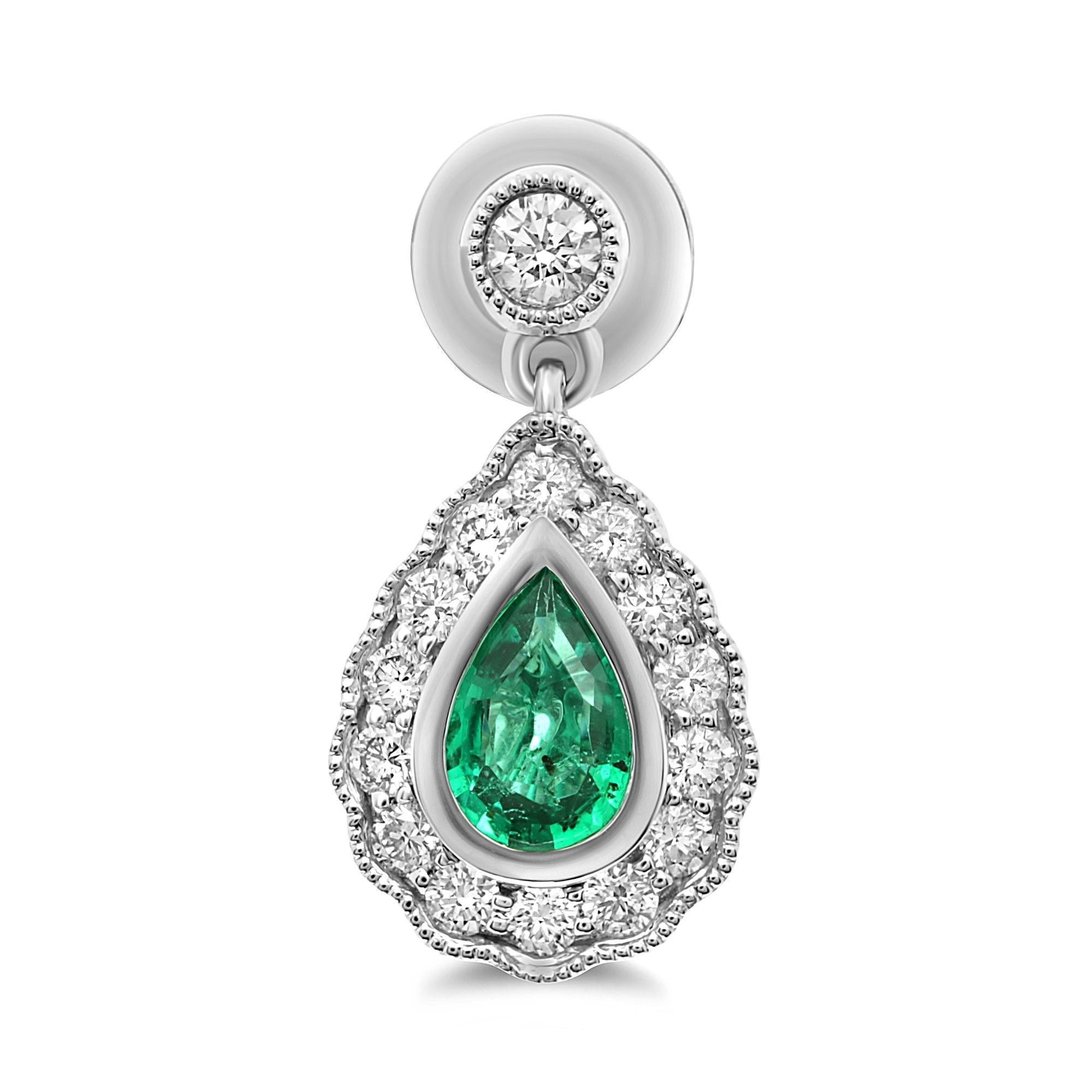 At the center of these stunning 18 karat white gold earrings rest 0.70 carats of pear-shaped emeralds. The colorful center stones are brought to life by 0.50 carats of white diamonds, set in single halos around the emeralds and enhanced by milgrain
