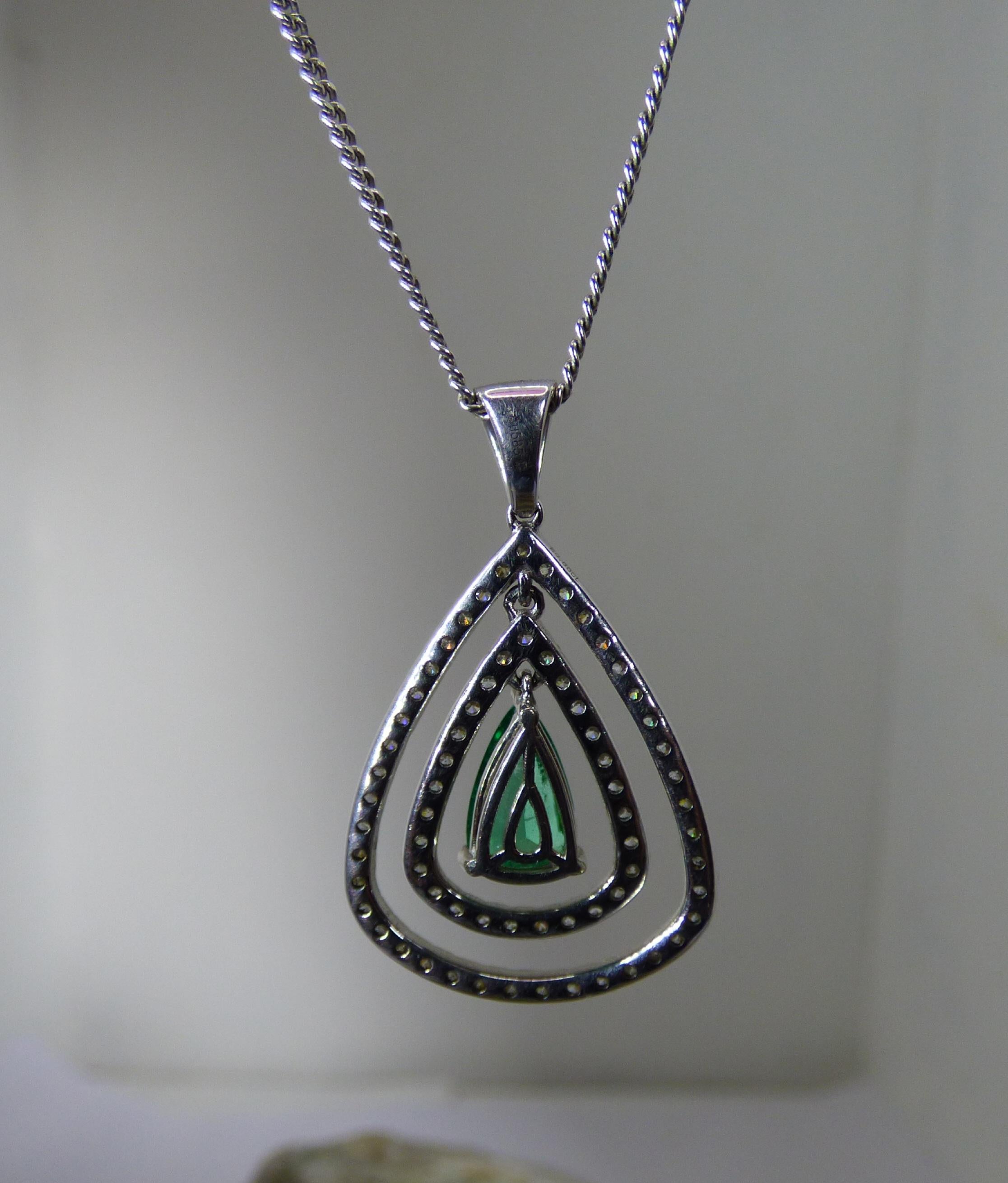 Contemporary Pear Shaped Emerald and Diamond Pendant For Sale