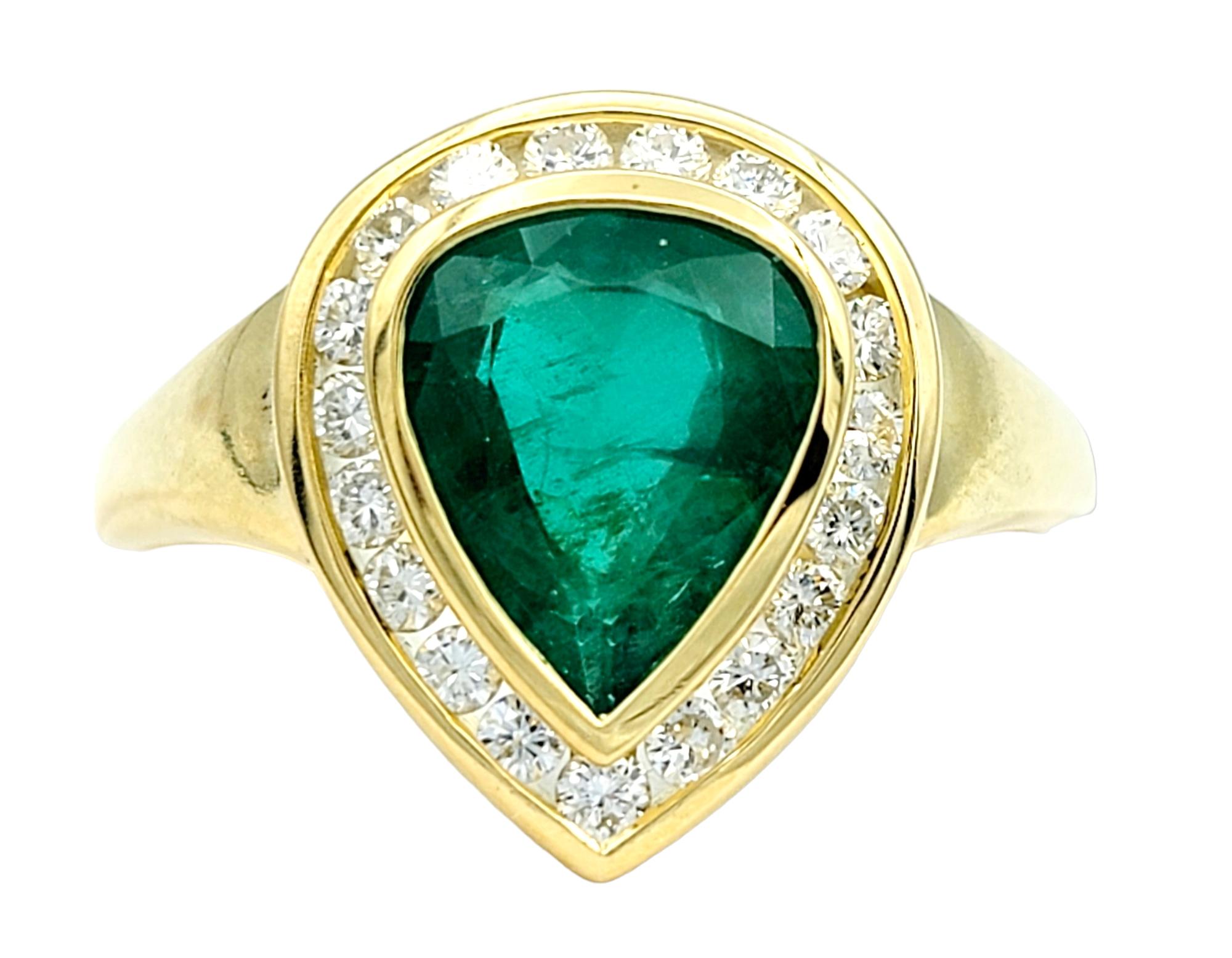 Contemporary Pear Shaped Emerald and Round Diamond Halo Band Ring Set in 18 Karat Yellow Gold For Sale