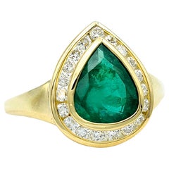 Pear Shaped Emerald and Round Diamond Halo Band Ring Set in 18 Karat Yellow Gold