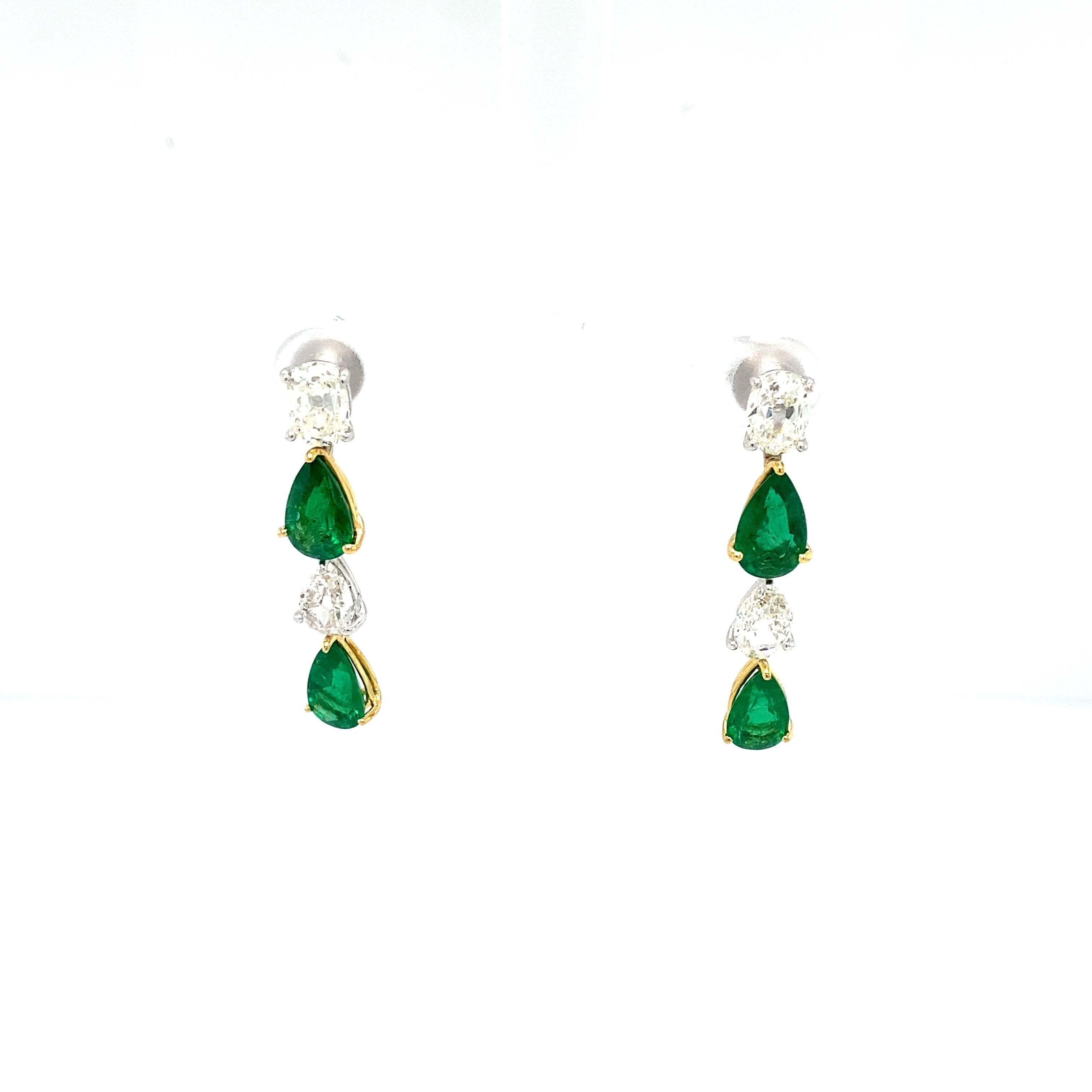 Pear Shaped Emerald and White Diamond Gold Dangle Earrings:

A very elegant pair of earrings, it features four gorgeous pear-shaped natural emeralds weighing 4.06 carat, with four white diamonds in between the gems weighing 3.34 carat. The emeralds