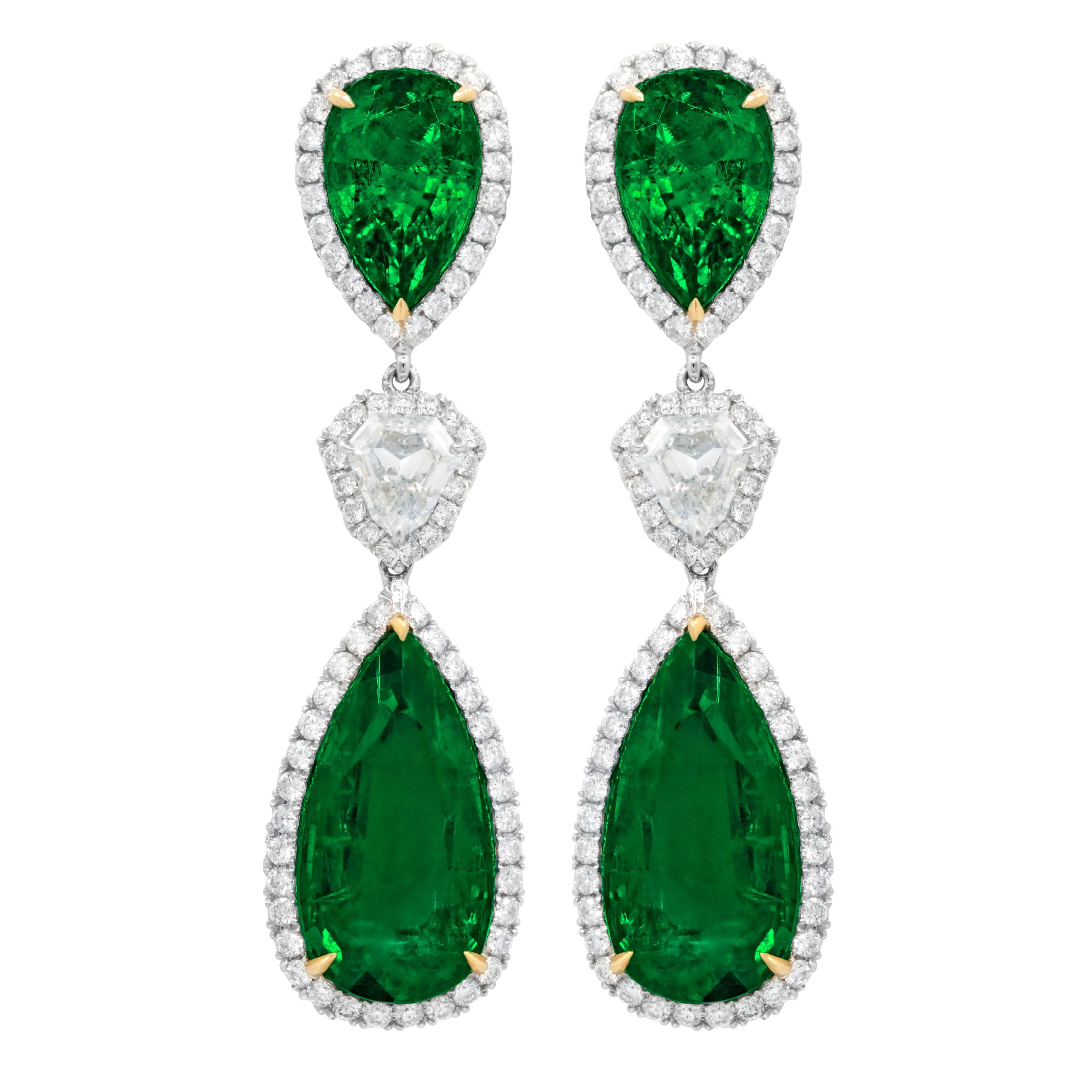 Pear shaped emerald diamond drop earrings with two GIA certified  em (29.50em) and two emeralds all surrounded by micropave white round diamonds(4.60ct) 

