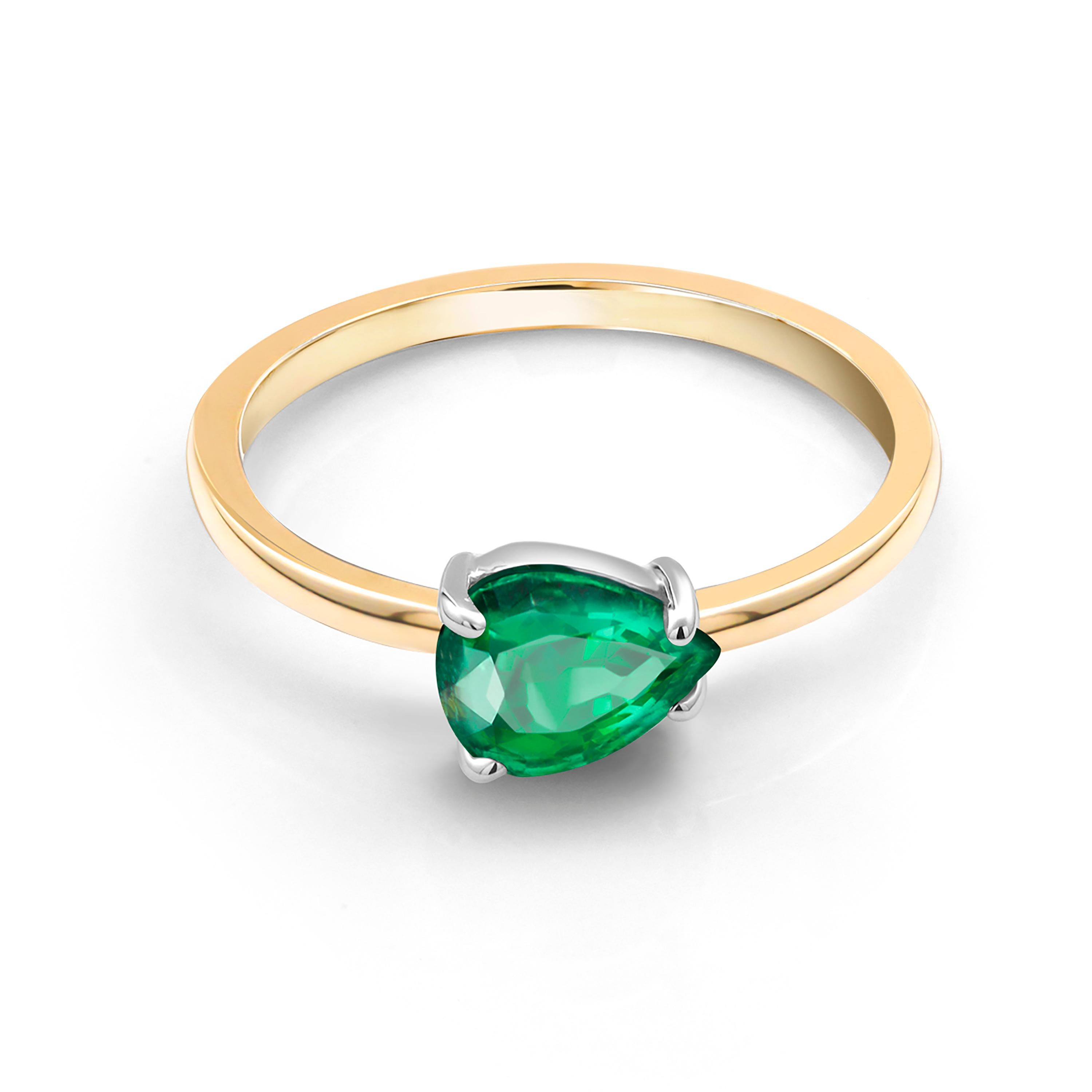 Fourteen karats yellow gold shank and 14k white gold box contemporary stacking cocktail ring
Colombia bright and brilliant green pear shape emerald weighing 1.20 carat       
Emerald measuring 8.5x6.2 millimeter                                      