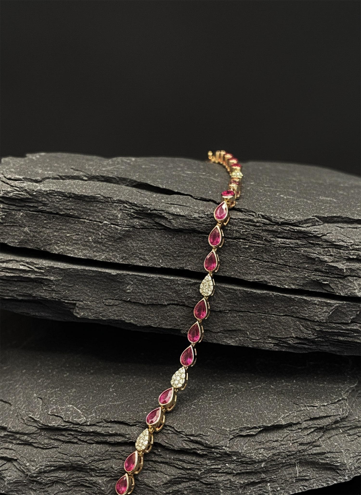 The Pear Shaped Evil Eye 14K Yellow Gold Ain Hara Bracelet blends elegance with protection. Adorned with natural diamonds and red rubies, this striking piece is designed to shield you from negative energies while adding a touch of sophistication to