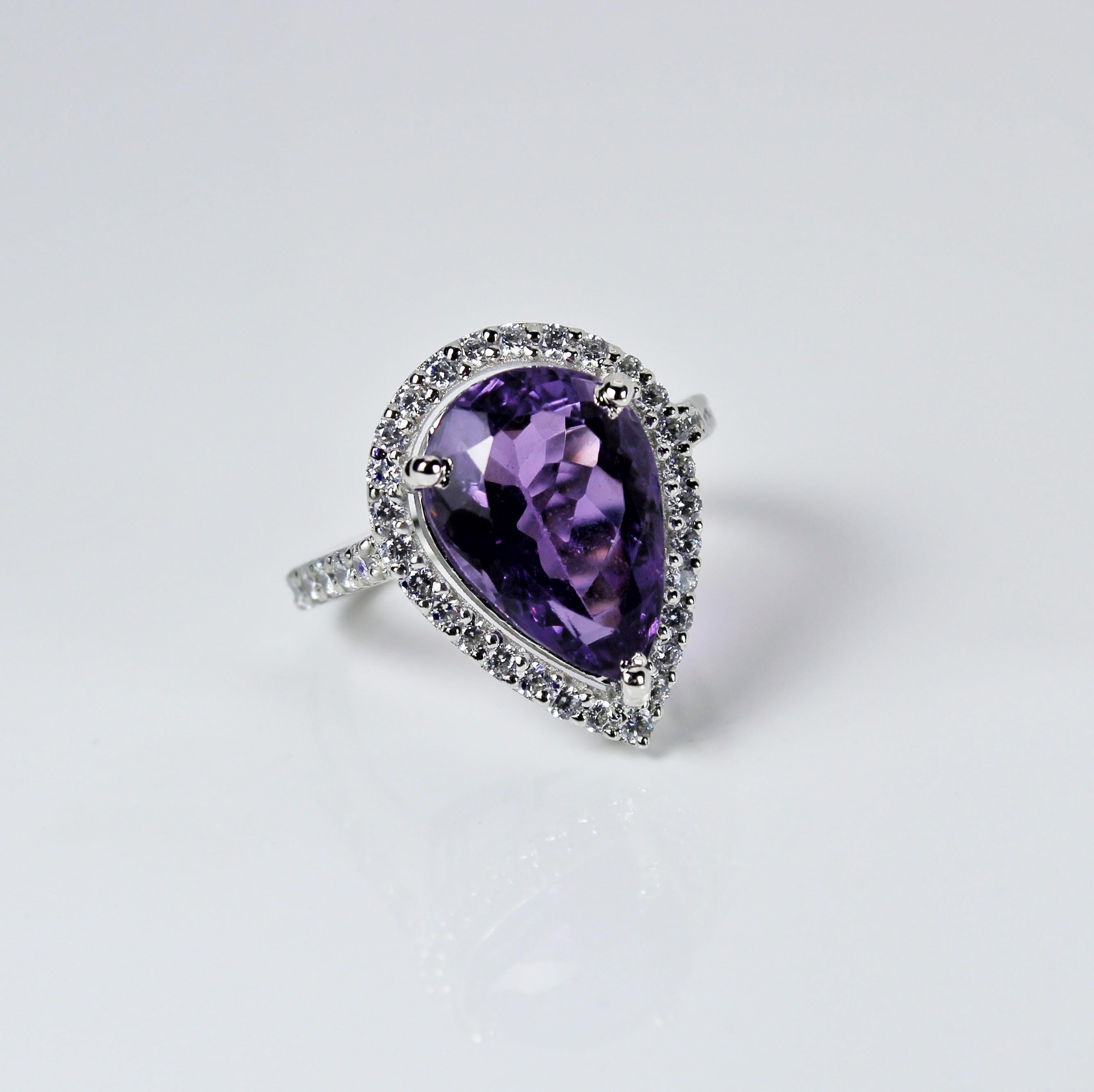 Product Details:

Metal - Silver
Indian ring size - 10
Product gross Weight - 5.350 Grams
Gemstone - Amethyst
Stone weight - 6.95 Carat
Stone shape - Pear
Stone size - 14 x 10 mm

The faceted amethyst gemstone catches the light beautifully, creating
