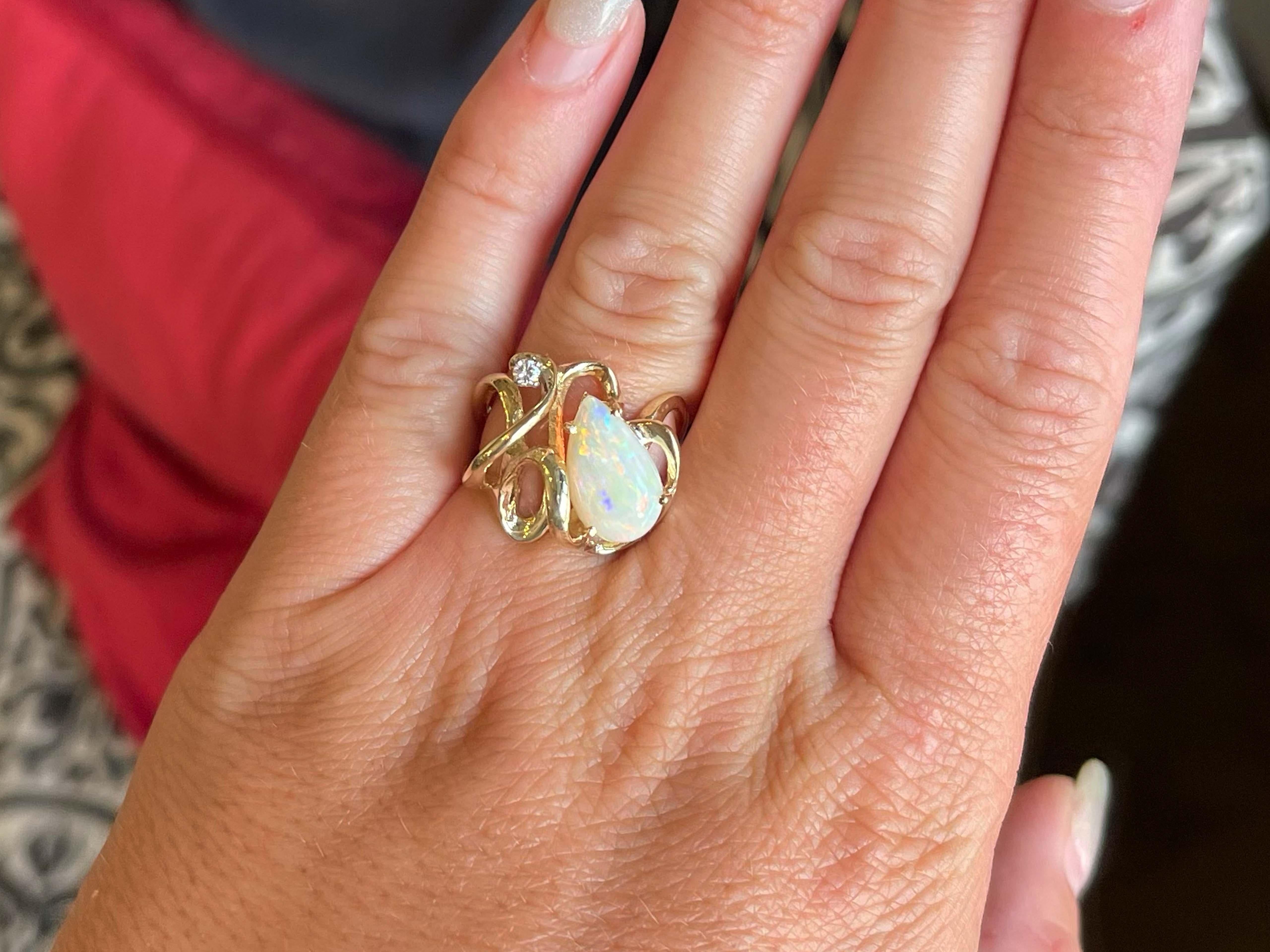 Item Specifications:

Metal: 14K Yellow Gold 

​​​Ring Size: 7

Total Weight: 6.5 Grams

Gemstone Specifications:

Center Gemstone: Opal

Gemstone Measurements: ~13.49 mm x 8 mm x 2.9 mm

Gemstone Carat Weight: ~1.02 carats

Diamond Count: