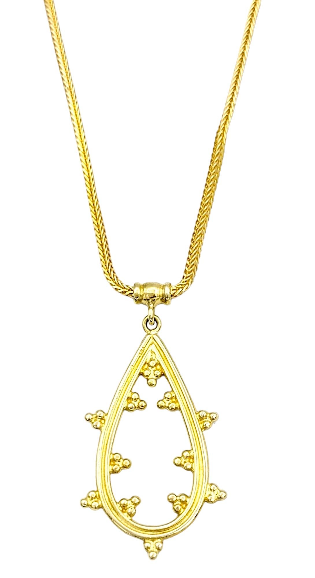 This pear-shaped dangle pendant necklace, crafted in beautiful 18 karat yellow gold, exudes a timeless elegance that will elevate your jewelry collection. 

This stationary pendant is made up of entirely yellow gold, molded into a beautiful open