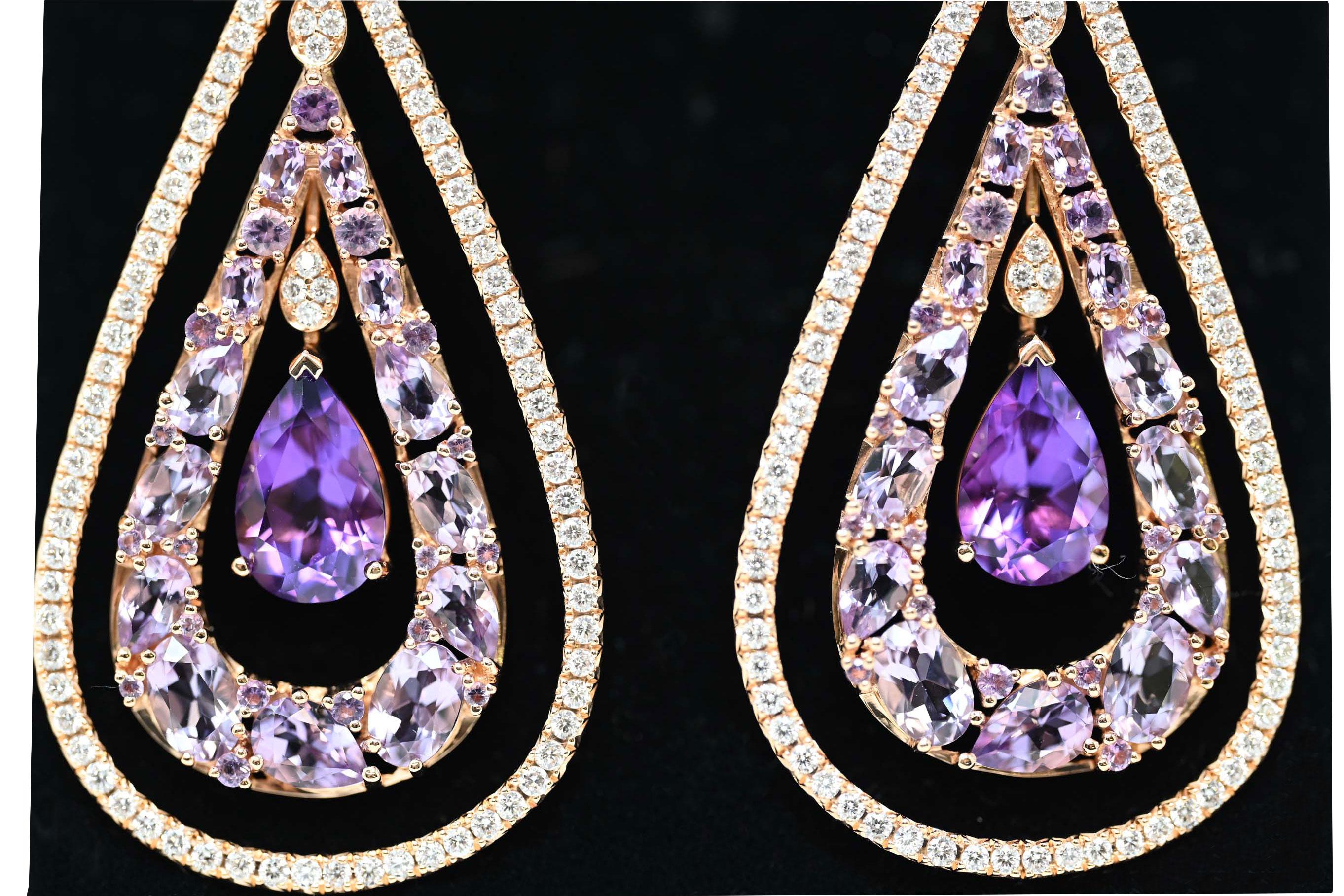 One pair of ear pendants in rose 18 karat gold, pear shaped with omega closing system. Total weight of 22.3 grams. The earrings are set with two hundred round brilliant cut diamonds, average weight 0.01 carat each, total weight 2.00 carats.