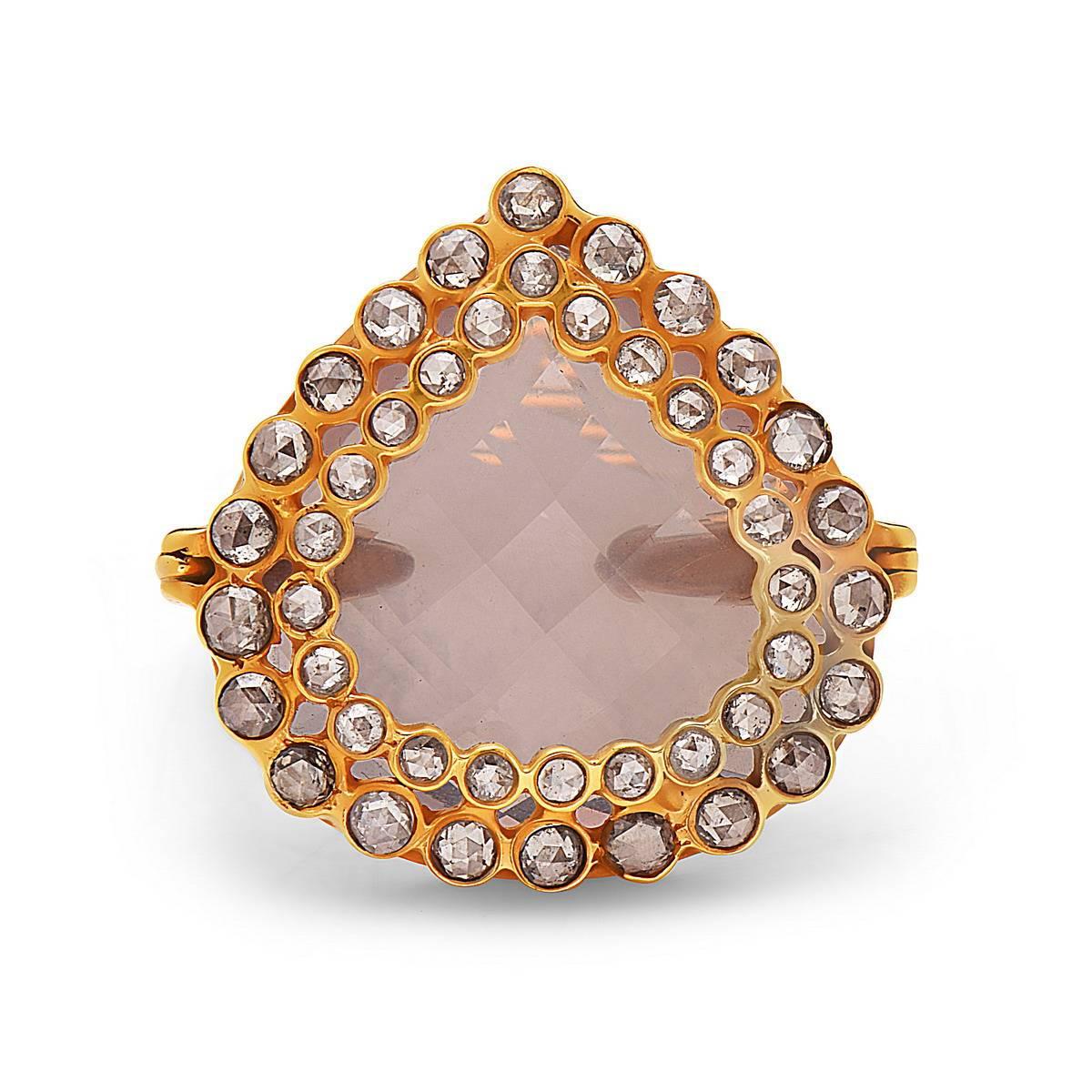 Fancy and gorgeous rose quartz ring with diamonds set on top in 18K yellow gold. 

Ring Size: 7 ( Can be sized )

18k: 7.58gms
Diamond: 1.68ct                             
Rose Quartz: 20.60cts
                                                       