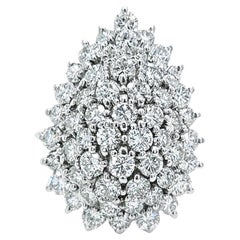 Pear shaped round diamond cluster ring in white gold