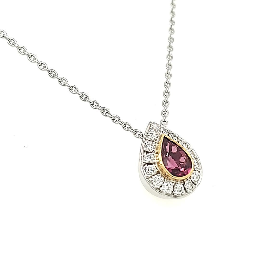 Embark on an emotional journey with our Pear-Shaped Rubellite Diamond Pendant, a captivating expression of elegance and sentiment. 

The heart of this pendant is a Pear-Shaped Rubellite, a precious gem weighing 0.80 carats, delicately cradled in a