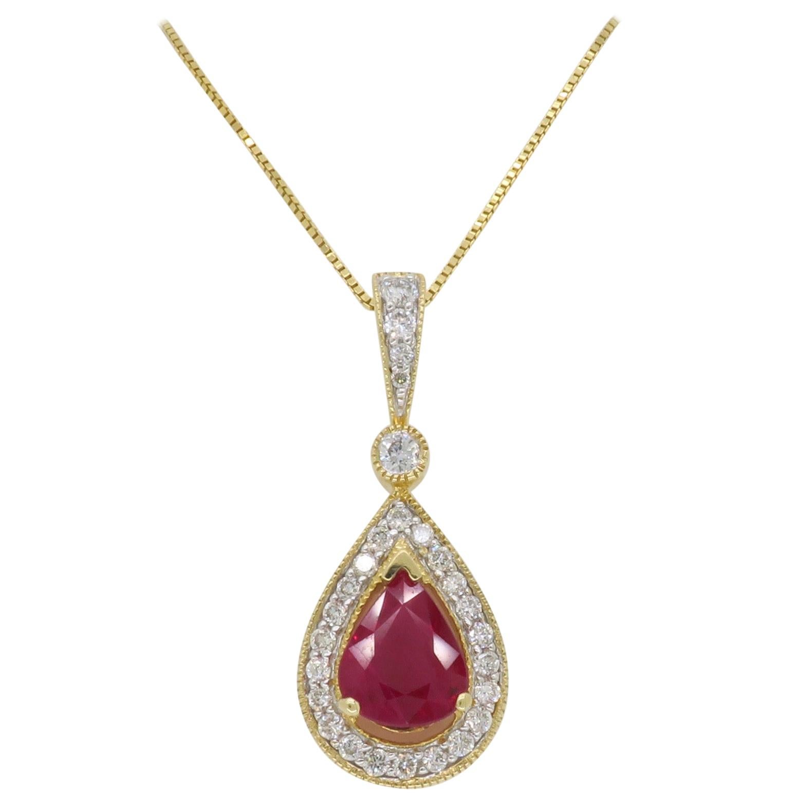 Pear Shaped Ruby and Diamond Halo Pendant in Yellow Gold
