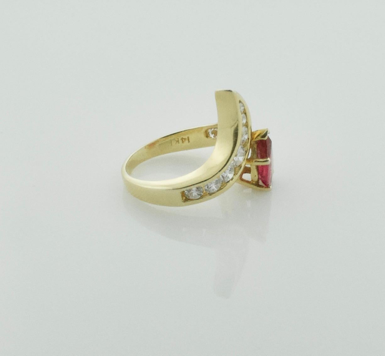 Modern Pear Shaped Ruby and Diamond Ring in 18 Karat For Sale