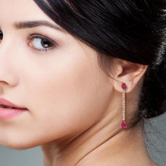 Pendientes de cadena de rubí en forma de pera con diamantes de oro de 18k