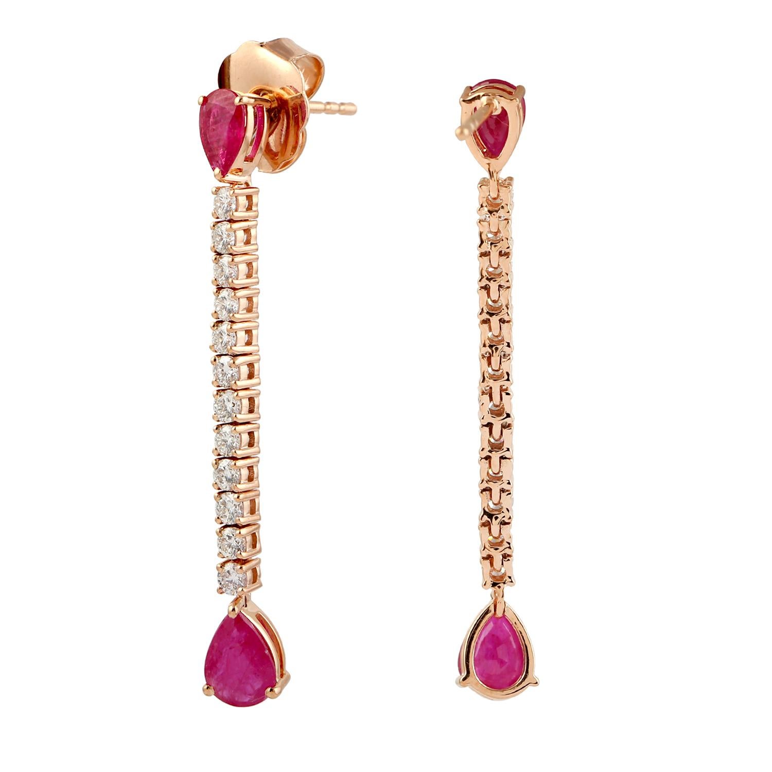 Contemporary Pear Shaped Ruby Chain Earrings With Diamonds Made In 18k Gold For Sale