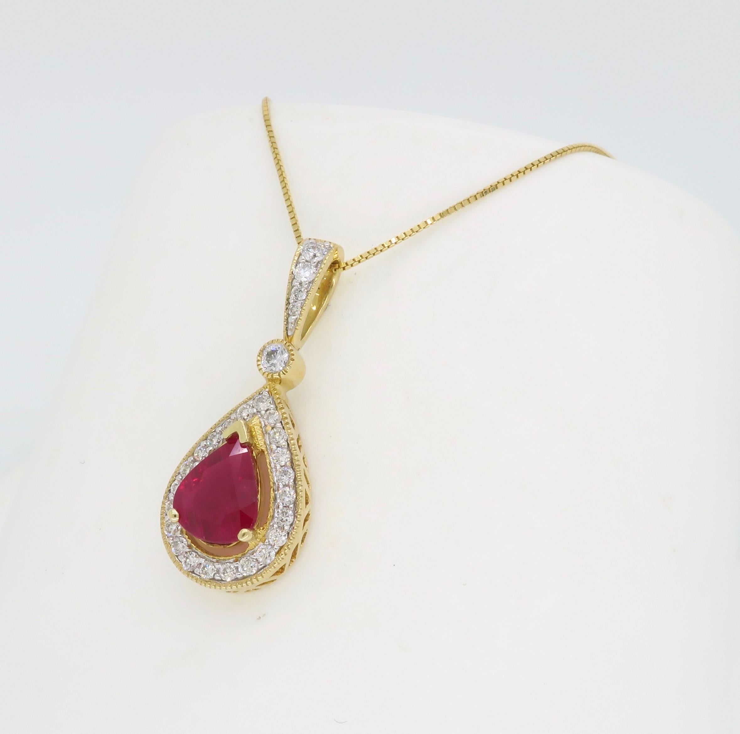 Pear shaped ruby and diamond pendant necklace crafted in 14k yellow gold. 

Gemstone: Ruby & Diamond
Gemstone Carat Weight: Approximately 1.10CT
Diamond Carat Weight: .23CTW
Diamond Cut: Round Brilliant Cut Diamonds
Color: Average G-I
Clarity: