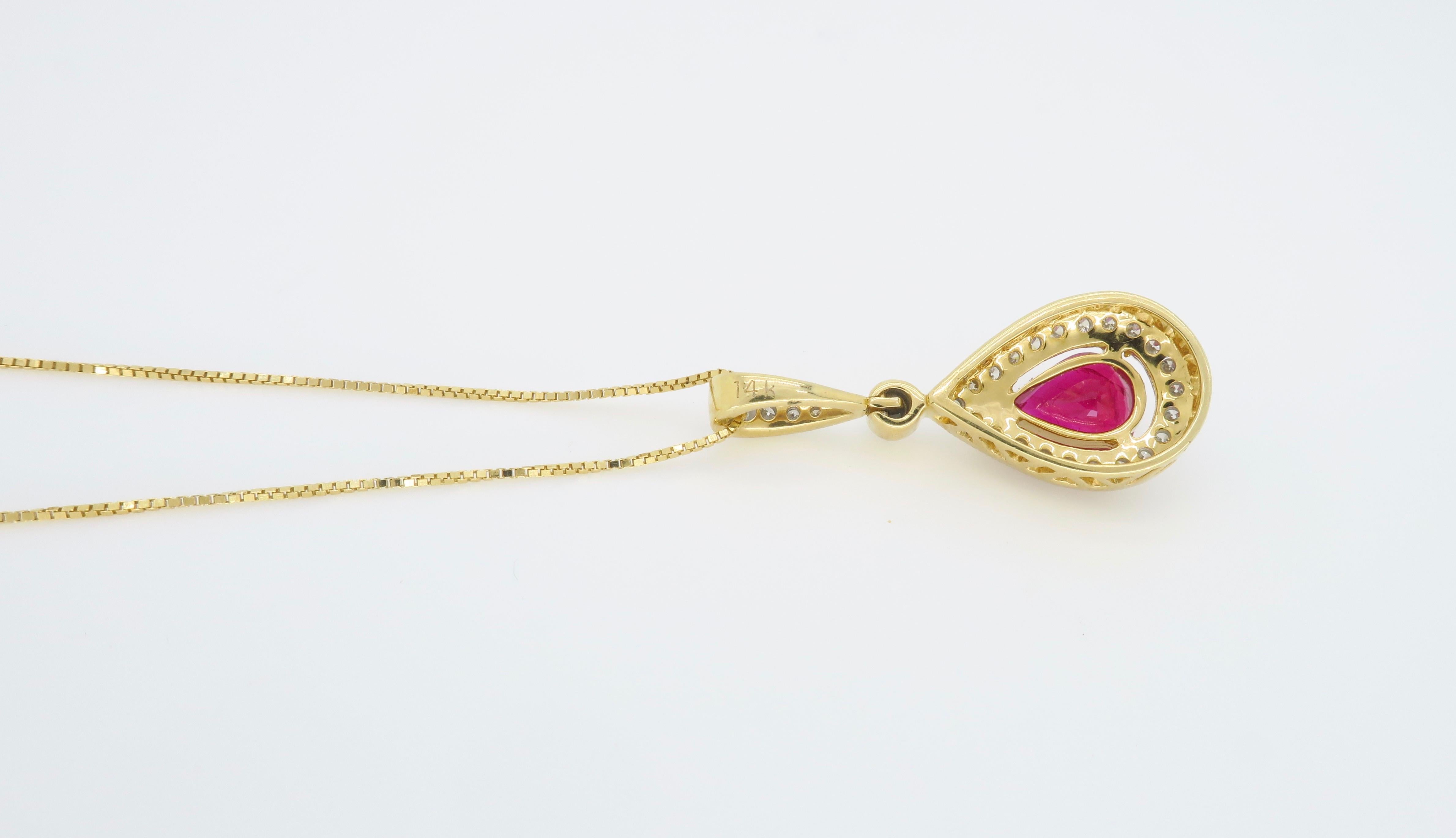 Pear Cut Pear Shaped Ruby and Diamond Halo Pendant in Yellow Gold