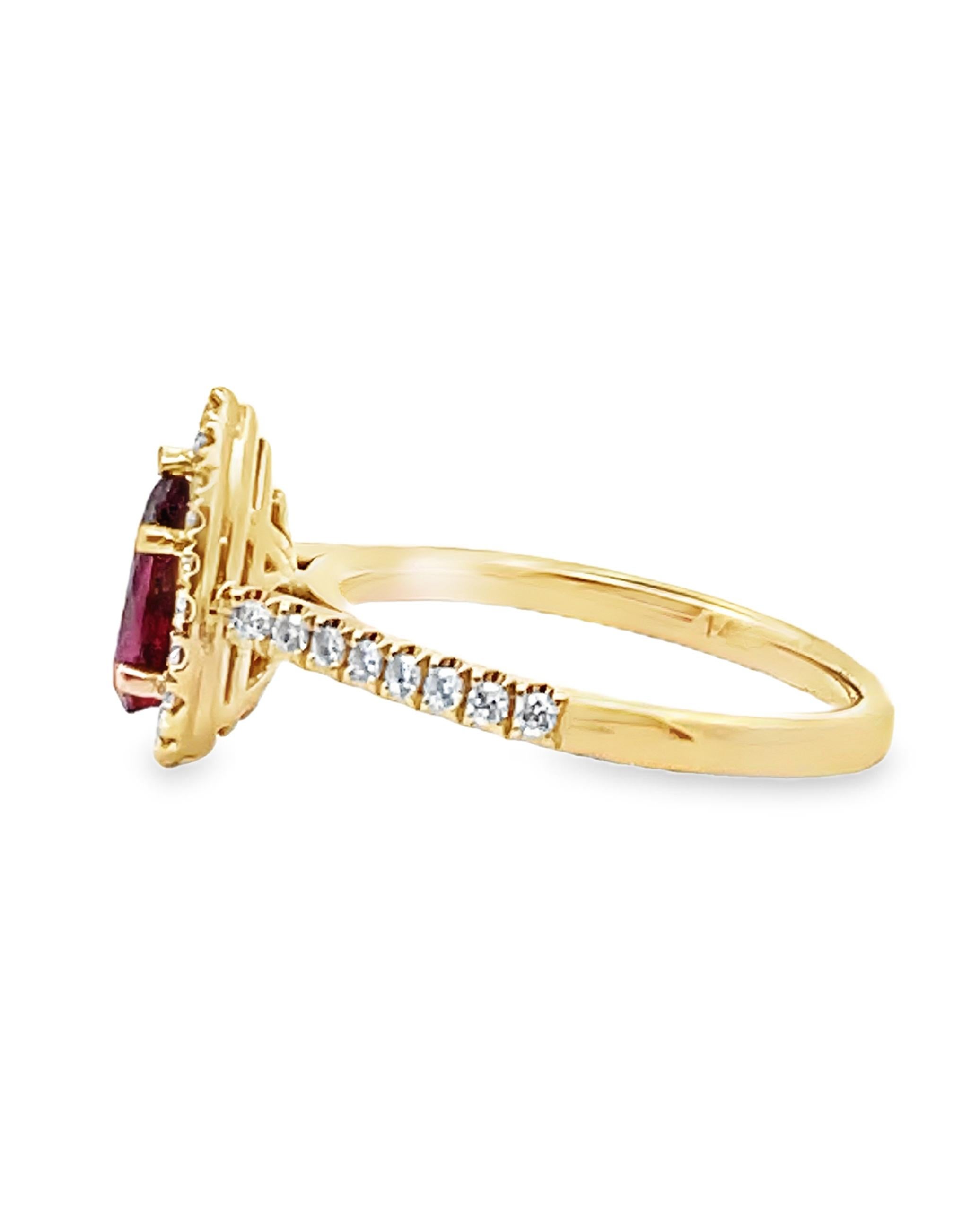Contemporary Pear Shaped Ruby Ring with Halo Diamonds Set in 14K Yellow Gold For Sale