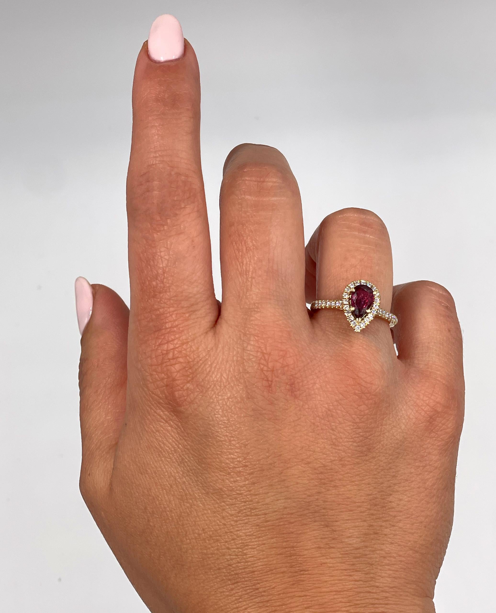 Women's Pear Shaped Ruby Ring with Halo Diamonds Set in 14K Yellow Gold For Sale