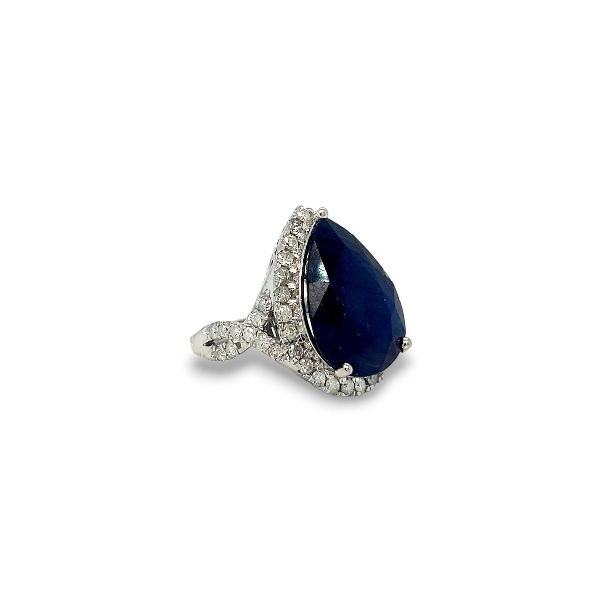 Pear Cut Pear Shaped Sapphire (17.01 carats), Diamond Halo, and Crisscross Band Statement For Sale