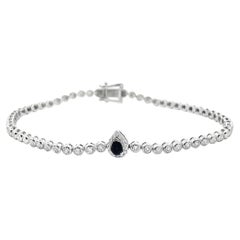 Bracelet tennis en or blanc 18 carats avec saphirs en forme de poire et diamants sertis sur lunette