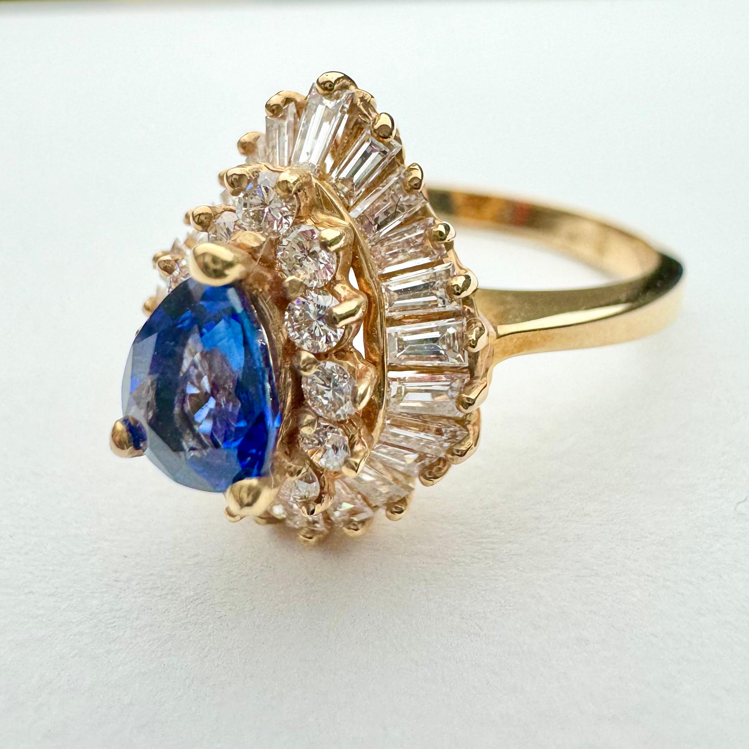 Women's Pear shaped Sapphire and Diamond Ring in 14k yellow gold For Sale