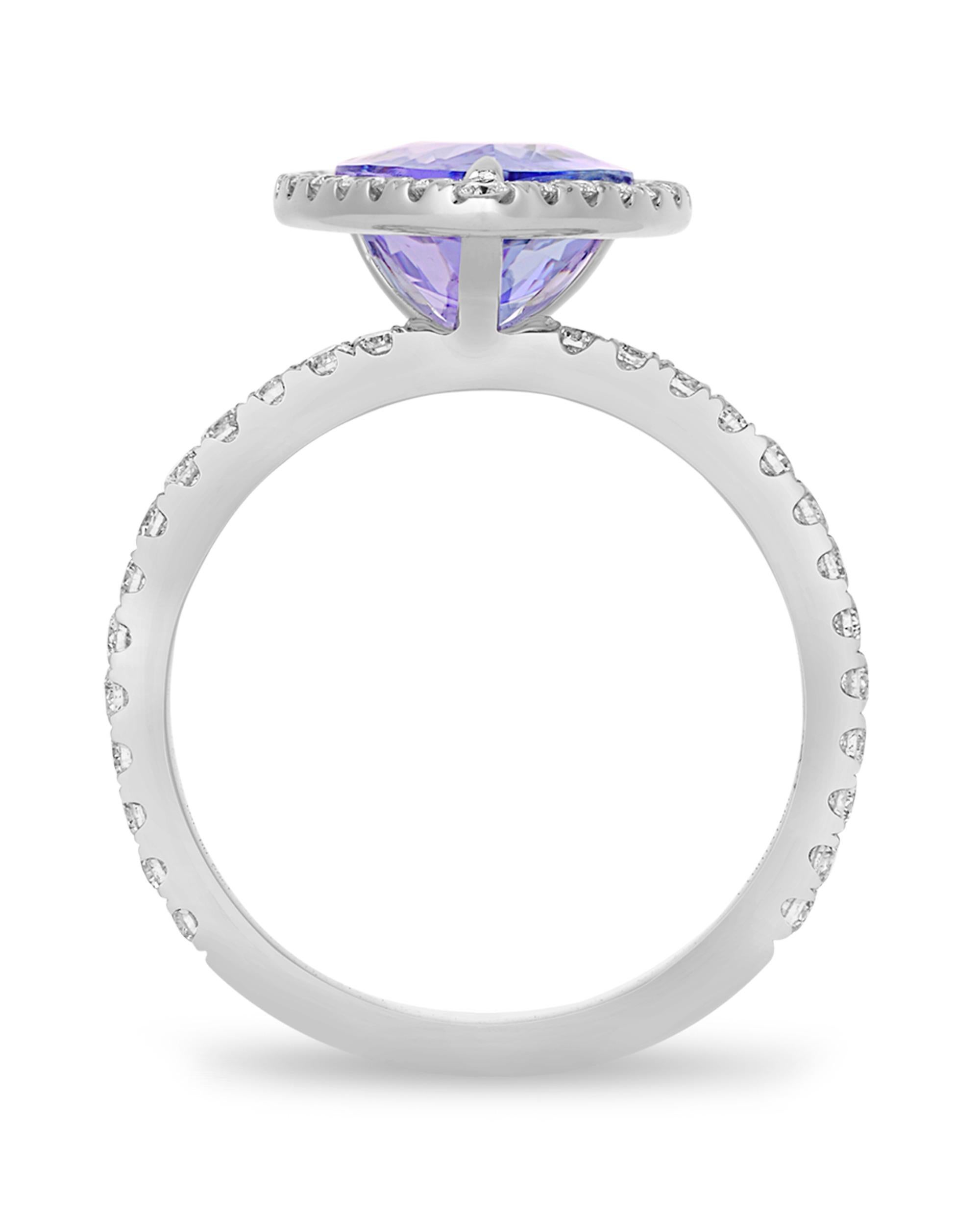 A violet-hued pear-shaped tanzanite weighing 3.28 carats is set in this classic ring. Diamond accents totaling approximately 0.66 carat join the gem in its 18K white gold setting.
